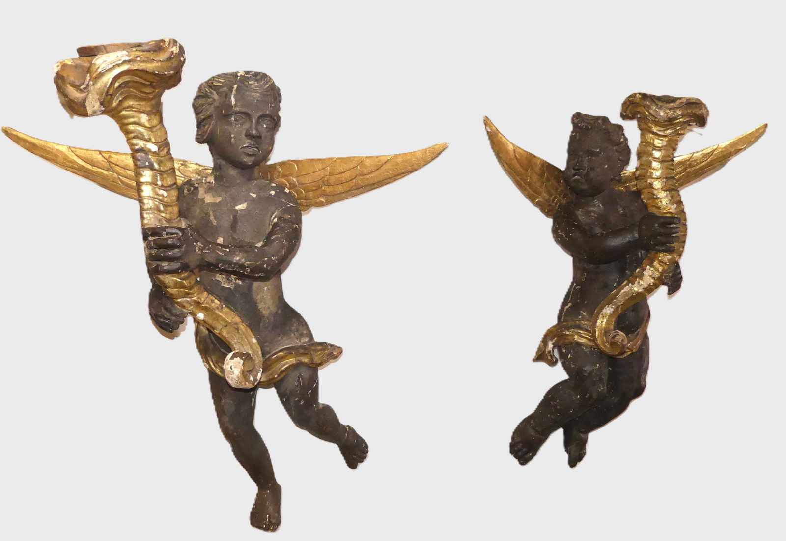 PR. HUGE 18TH C. WINGED CHERUBS: Pair of early carved and painted wood, large winged architectural wall cherubs, 18th century or possibly earlier. 4 feet high, about 3 ft wide (across wings), and 18 in deep. They have flaking paint