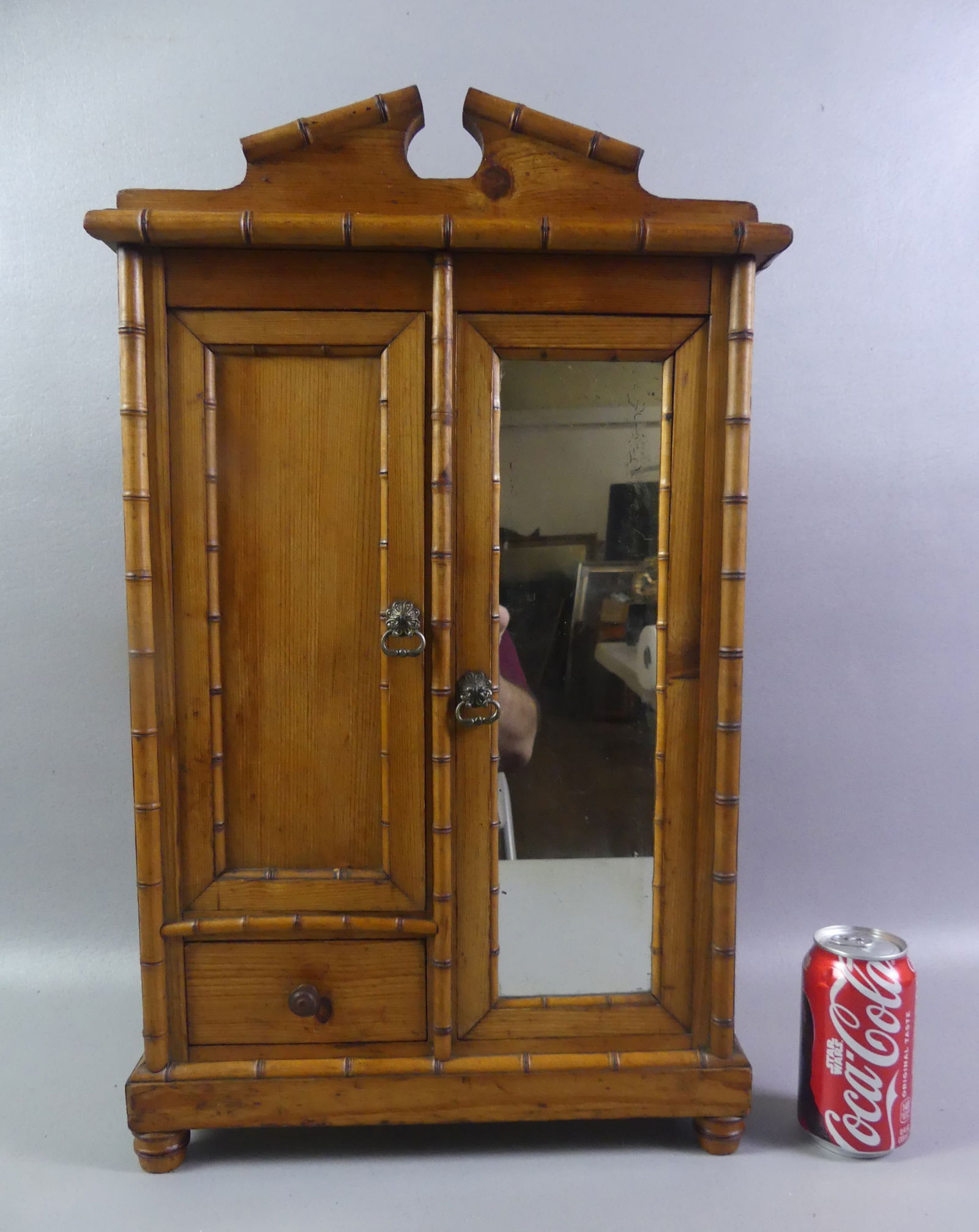 VICTORIAN BAMBOO MINI ARMOIRE: Victorian 2 door bamboo pine armoire with single drawer. 23 in tall x 14 w x 6 in deep. NOTE: We can ship this item in-house.