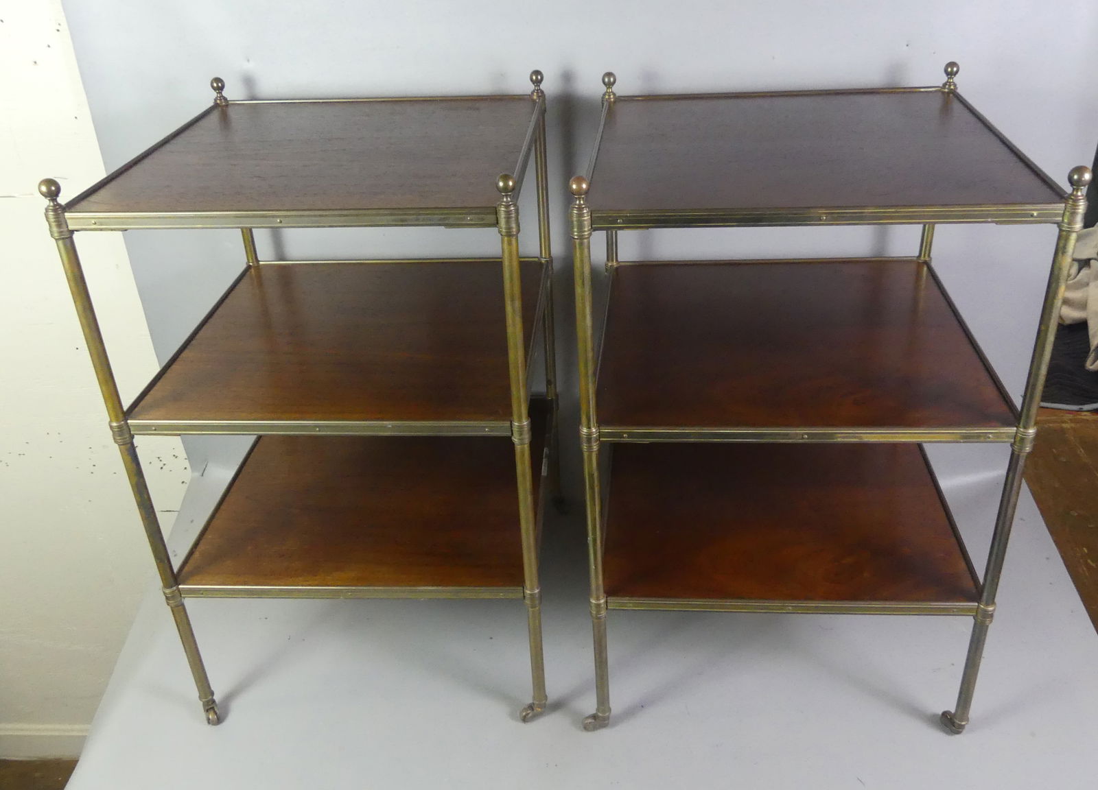 PAIR 3 TIER MAHOGANY TABLES: Pair of fine quality custom mahogany 3 tiered tables with brass mounts. 17 in square and 28 in high. VG condition.