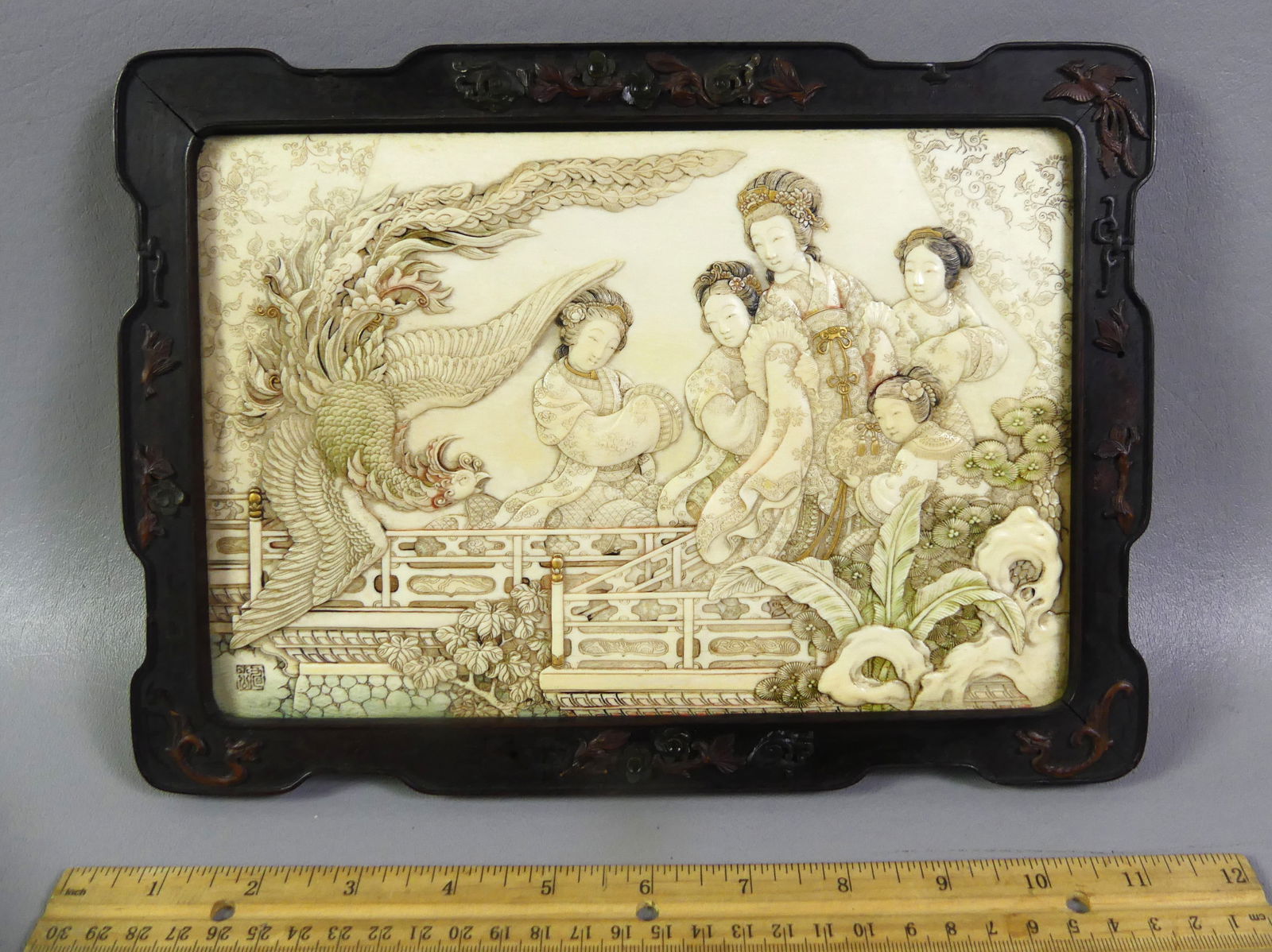 ANTIQUE CHINESE CARVED PLAQUE - GENRE: Exquisite 19th century Chinese carved and polychromed bone wall plaque depicting 5 Asian women in elaborate courtyard with exotic bird. Signed with Chinese seal in lower left. 9.25 x 6.25 inches,