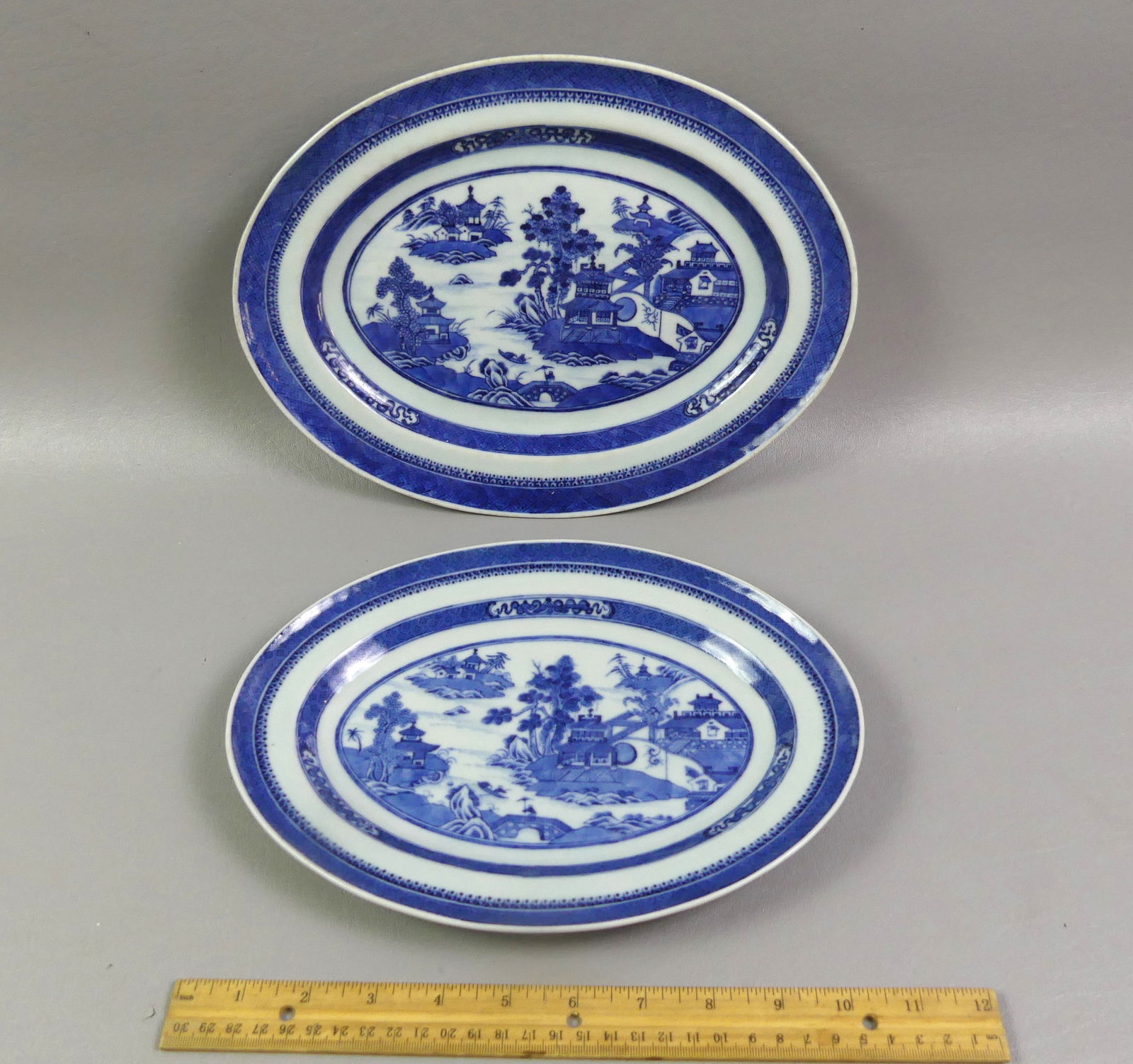 2 CHINESE NANKING PORCELAIN PLATTERS: Lot of two 19th century oval Chinese Export Nanking porcelain platters. 12 x 9 in and 10.75 x 7.75 in respectively. Both in mint condition. NOTE: We can ship this item in-house.