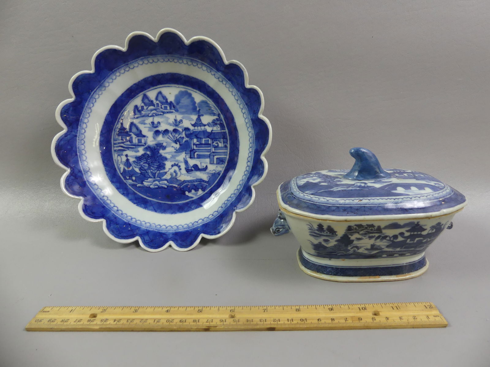 2 CHINESE CANTON SERVING PIECES: Two Chinese Export 19th century Canton blue and white ceramic serving pieces: 9 in by 2 in deep scalloped bowl; and a small hog-snout handled sauce tureen with cover, 7 x 4 inches. Both very good