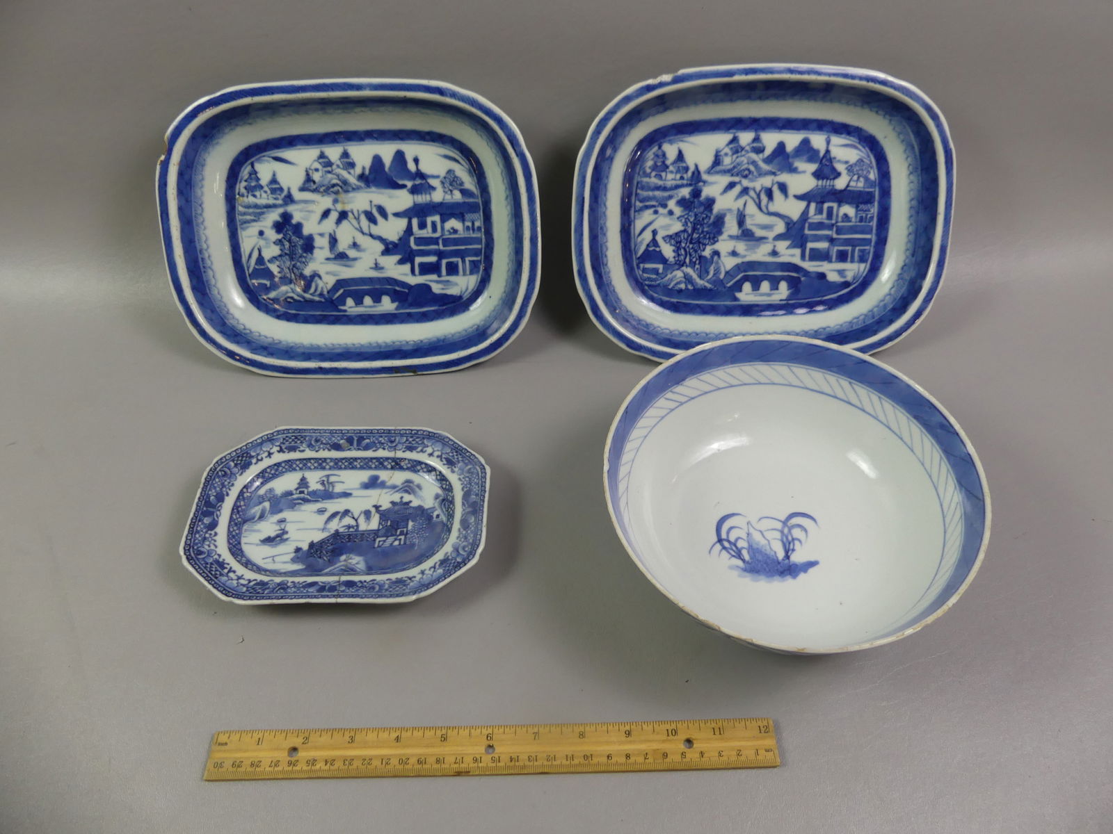 4 CHINESE EXPORT CANTON ITEMS: Lot of 4 Chinese Canton 19th century items: two rectangular serving bowls, both with a rim chip, 11 x 8.5 inches; 8.5 in fruit bowl (rim chips); and a 7.5 in tray with old staple repair. NOTE: We can