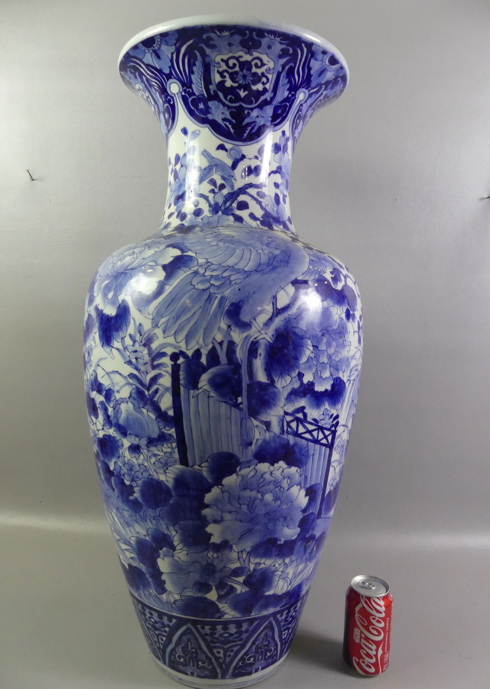 33 IN CHINESE FLOOR VASE: 19th century Chinese floor vase with blue and white decoration of large birds in a lush landscape. Unsigned. 32.5 x 8.5 in base. Condition: good with a clean, tight repair around the neck. NOTE: We