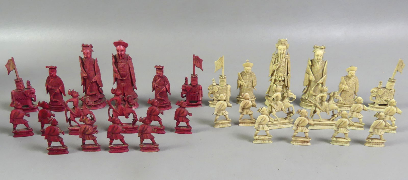 CHINESE CARVED CHESS SET: Old Chinese figural carved bone chess set, complete with 32 pieces. To 4 in tall. NOTE: We can ship this item in-house.
