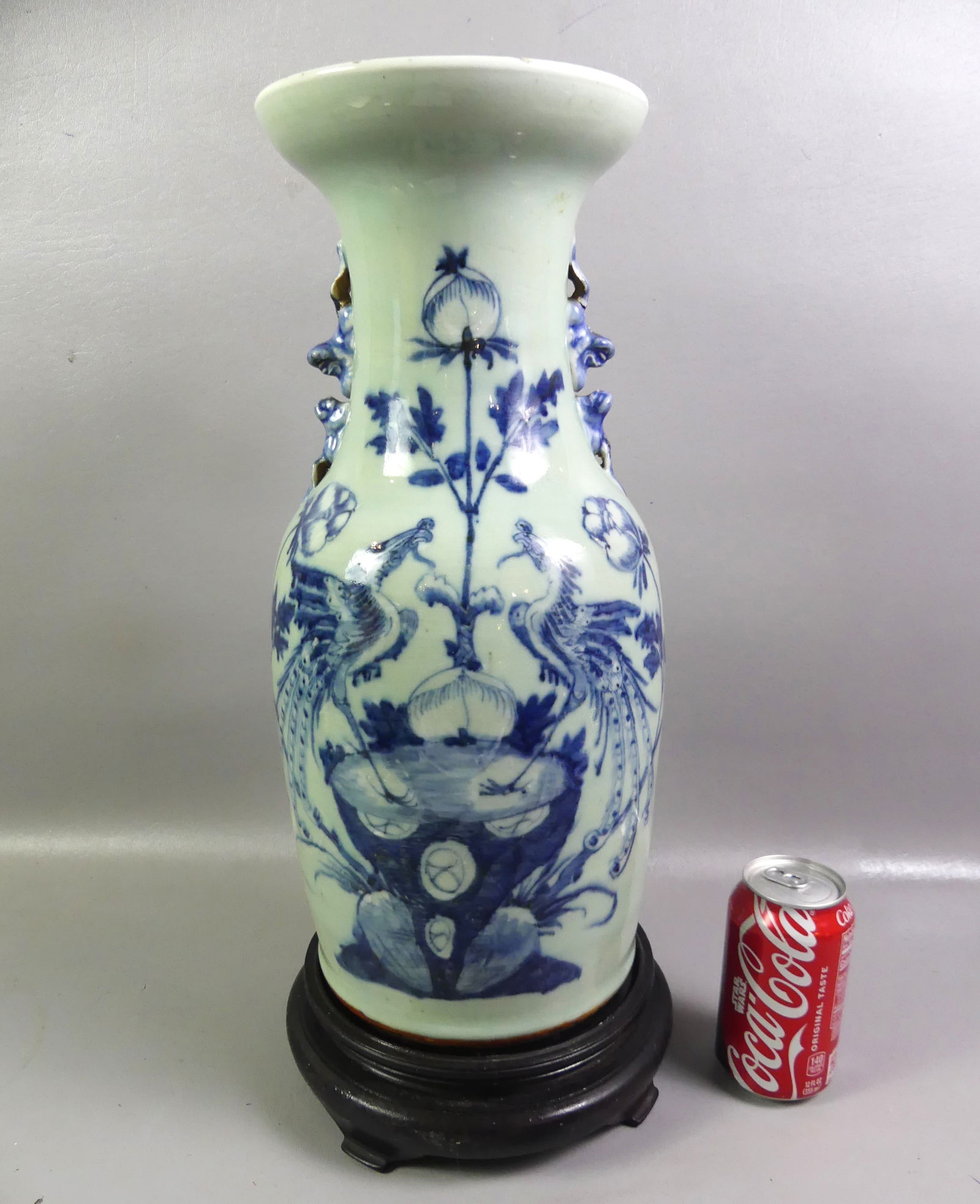 CHINESE CELADON VASE WITH DECORATION: 19th century Chinese pale celadon porcelain vase with decoration of 2 exotic birds and flowers. Unsigned, comes with wood base. 17 in high plus 2.5 in base. VG condition. NOTE: We can ship this item