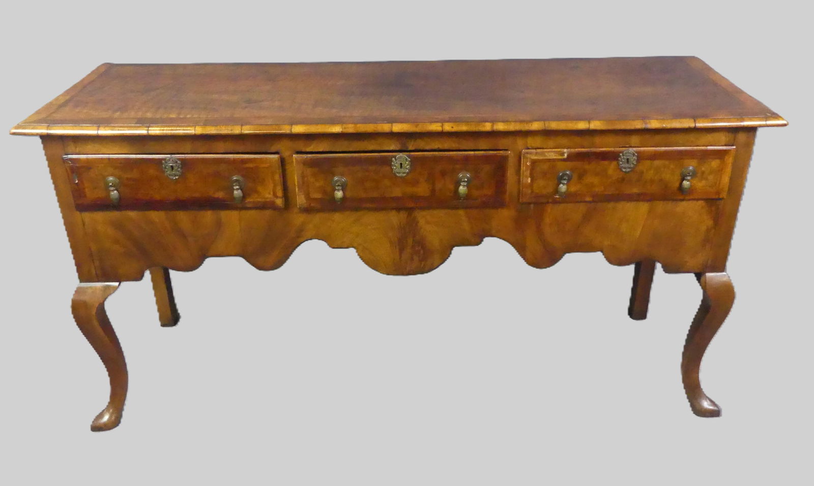 PERIOD ENGLISH QUEEN.ANNE SIDEBOARD: Period English Queen Anne 3 drawer sideboard with shaped skirt and band inlay. 65 in long x 33 h x 21d.