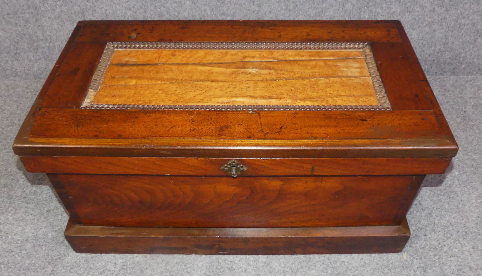 VICTORIAN TOOL CHEST: Victorian walnut tool chest with birdseye maple inset panel on lid (cracks). 27 x 14 x 13 inches.