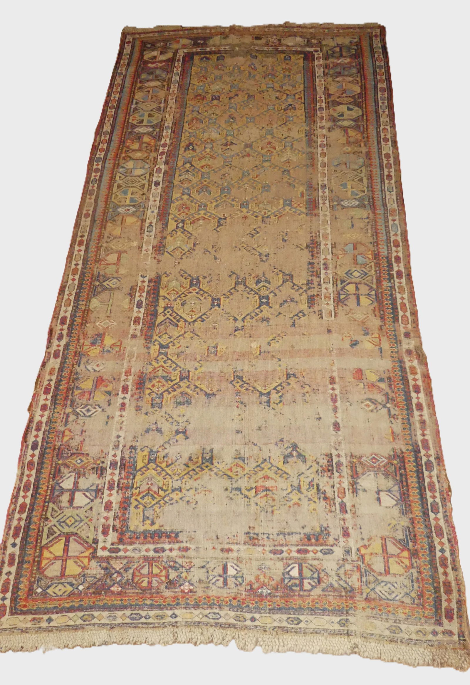ANTIQUE TURKISH RUNNER RUG: 19th century Turkish tribal runner carpet, 9 ft 4 by 4 ft wide. In as is condition with much wear. NOTE: We can ship this item in-house.