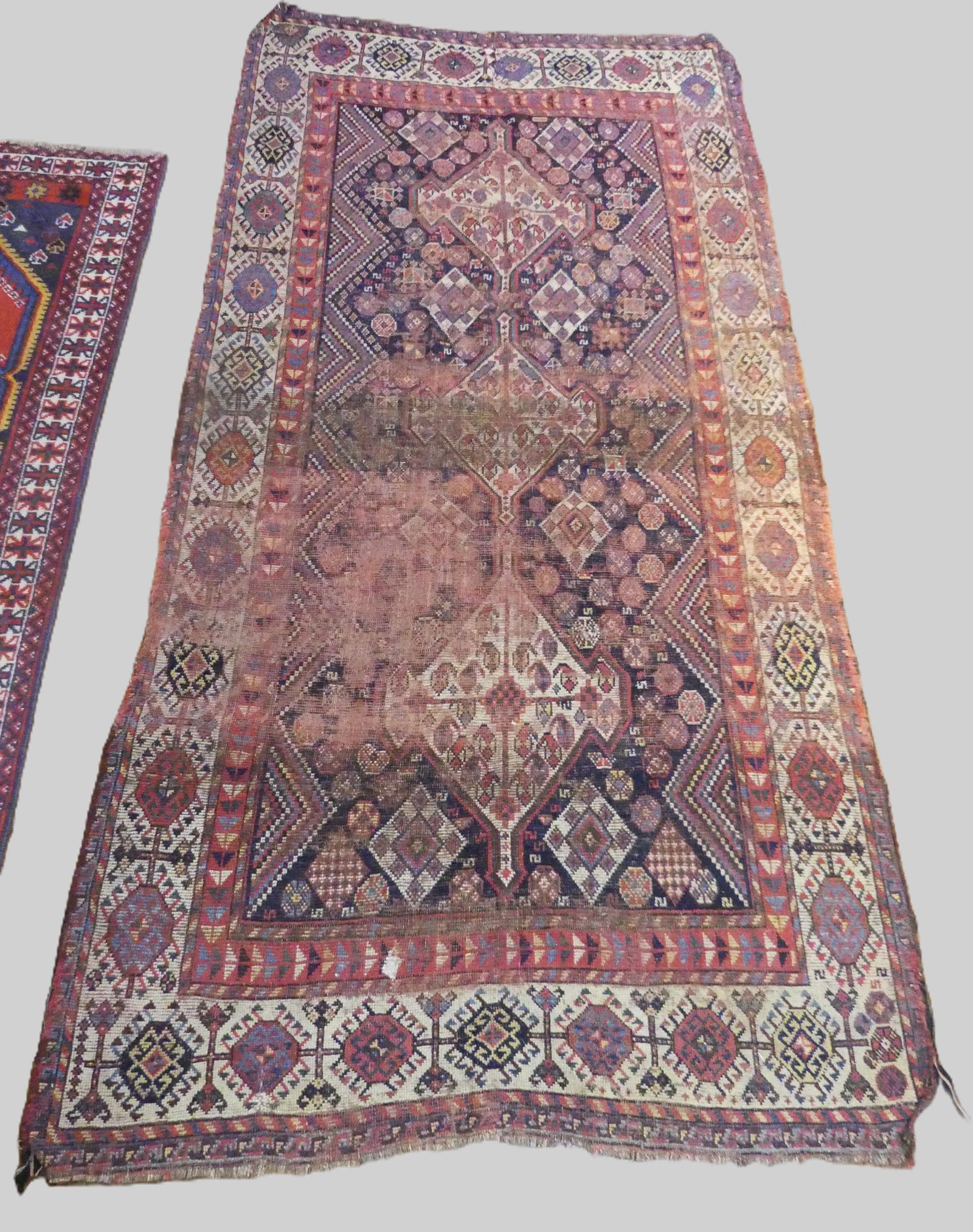 ANTIQUE CAUCASIAN SCATTER RUG: Antique Turkish or Moroccan scatter rug with wear (as is). Triple medallions with blue and red colors. 4 ft 4 by 9 feet long. NOTE: We can ship this item in-house.