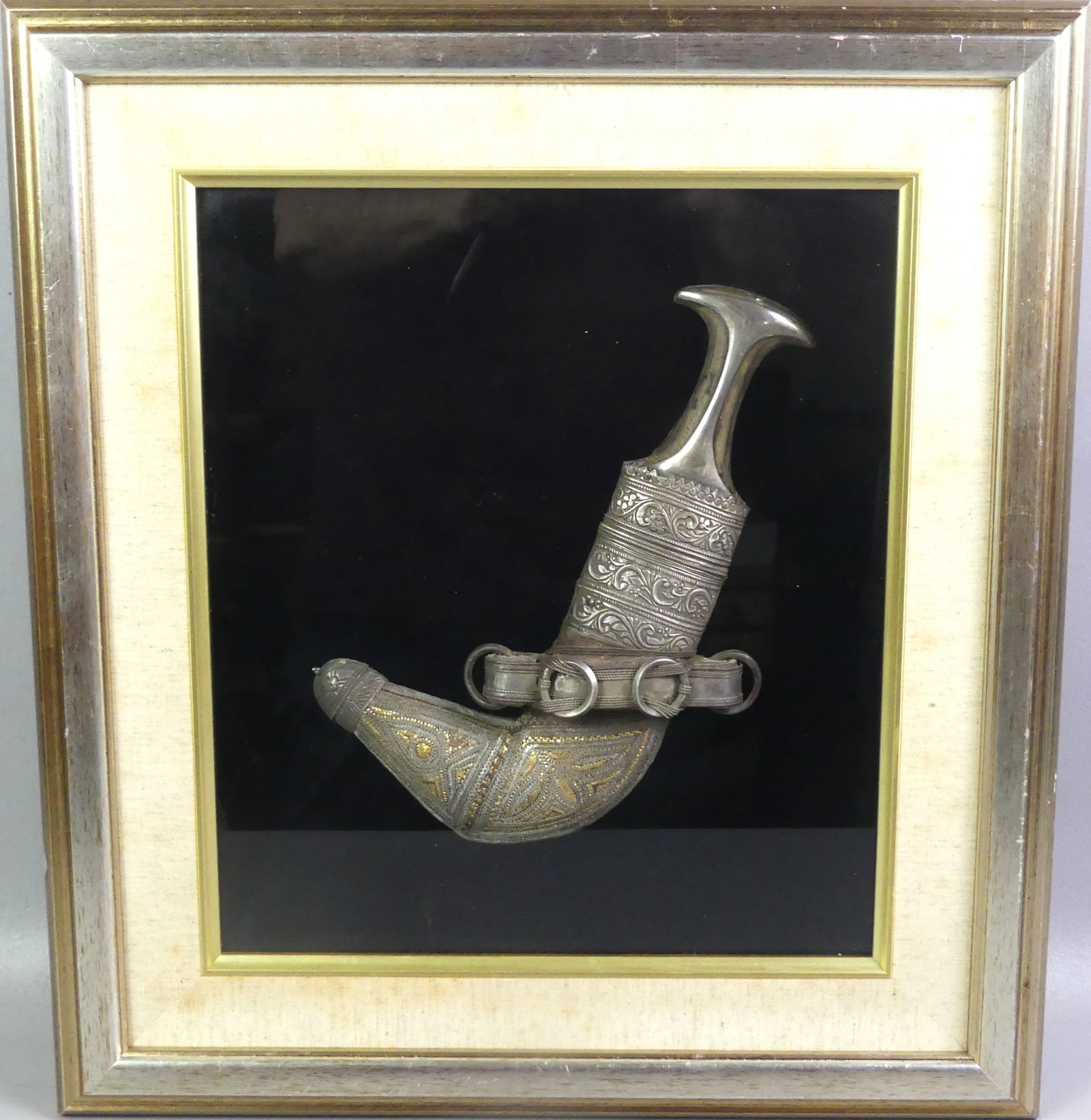 YEMENI SILVER JAMBIYA DAGGER: Old parcel-gilt, silver Yemeni Jambiya dagger mounted in shadowbox display frame. Dagger is 12 in long, overall 21 x 18 x 3 in deep.