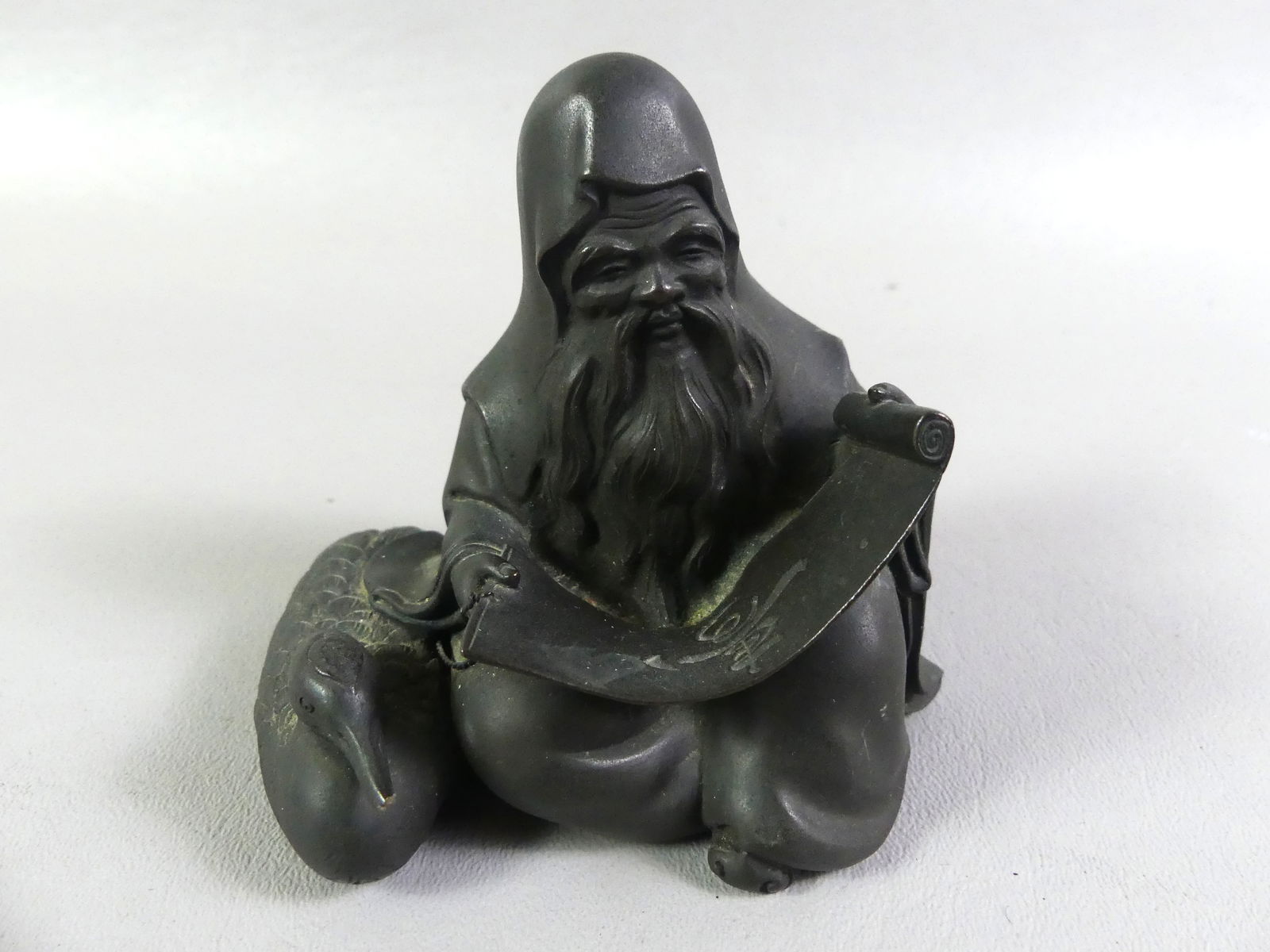 JAPANESE BRONZE FIGURE OF SCHOLAR - SIGNED: Small Japanese Meiji period bronze of a seated scholar holding scroll with a duck beside him. Signed. 3.75 x 4 x 3 inches. NOTE: We can ship this item in-house.