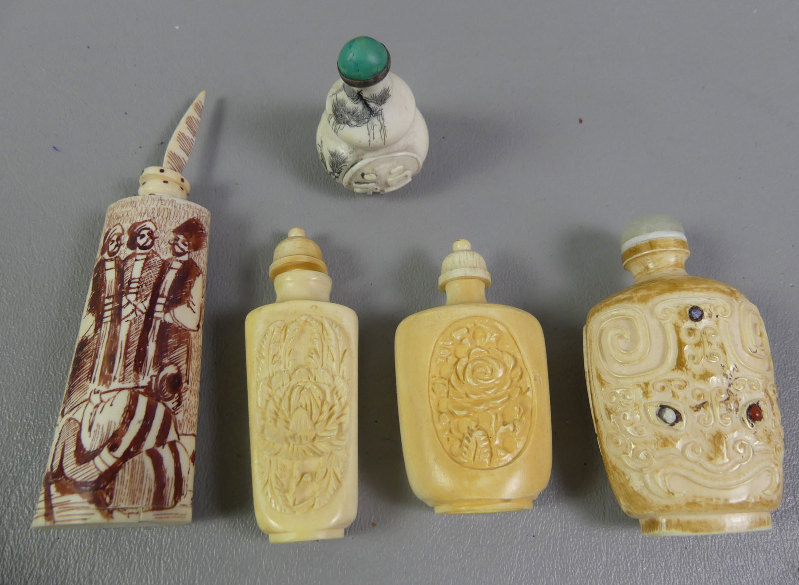 5 ASIAN CARVED SNUFF BOTTLES: Group of 5 old carved bone Asian snuff bottles as displayed to 4.5 in tall. NOTE: We can ship this item in-house.