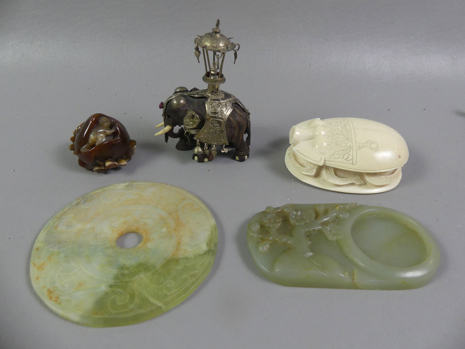 5 ASSORTED ASIAN ITEMS: Group of 5 assorted Asian items: 3.5 in carved bone scarab paperweight; carved Carnelian stone mini figure with monkey, 1.5 in; carved jade oval tray, 4.5 in; Chinese onyx disk, 4.25 in; and wood and