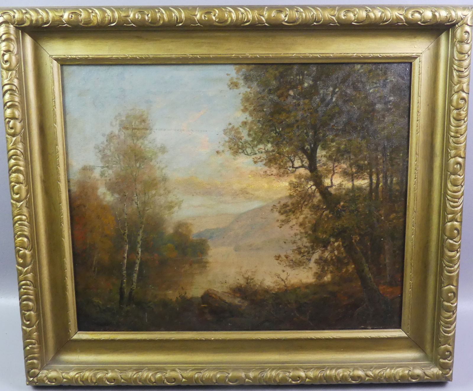 C.G. BEAUREGARD LANDSCAPE PAINTING: Antique oil painting on canvas of a luminist landscape with clearing and pond, mountains in distance signed CG Beauregard. 16 x 20, framed 21 x 25 in. (C.G. Beauregard was a Montreal Canada artist