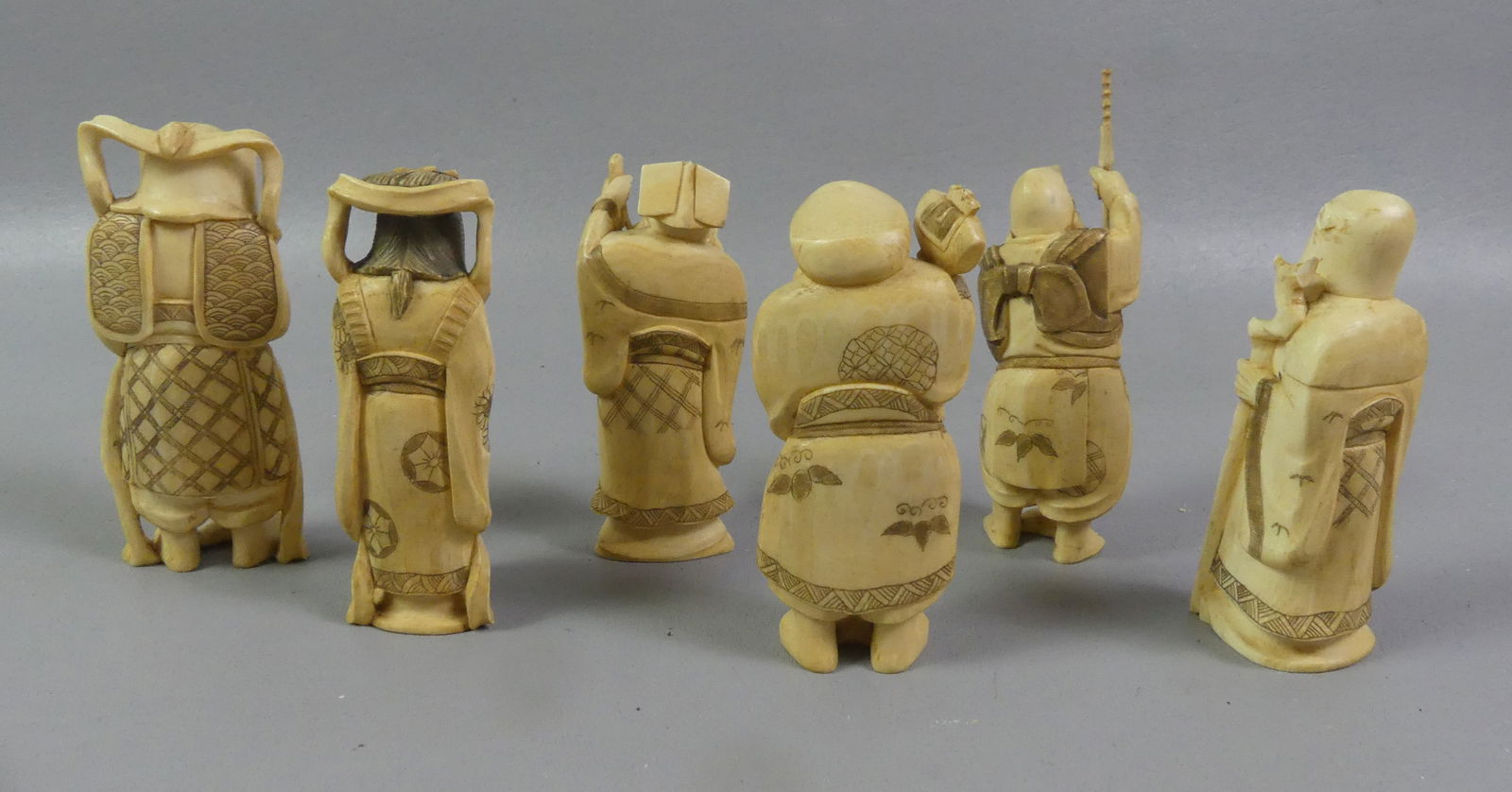 6 JAPANESE CARVED FIGURES: Group of 6 antique carved bone Japanese figures to 5 in tall, 5 men and one woman, all signed. Good condition. NOTE: We can ship this item in-house.