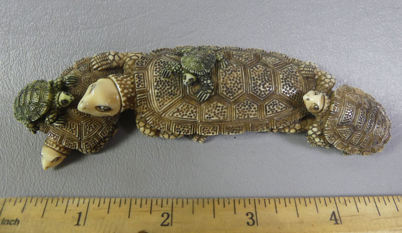 JAPANESE NETSUKE - 5 ALLIGATORS: Unusual antique carved and polychromed Japanese netsuke depicting 5 turtles. Signed. 5 in long x 1.25 x 1/2 in high. Ex-collection of Andrew C. Ware. NOTE: We can ship this item in-house.