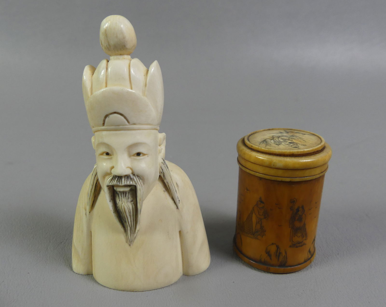 ASIAN SNUFF BOTTLE & BOX: Lot 2 carved bone Asian items: figural snuff bottle with Chinese man, signed, 3 x 1.75 in; and round trinked box with lid and carved figures, 1.5 in diameter. NOTE: We can ship this item in-house.