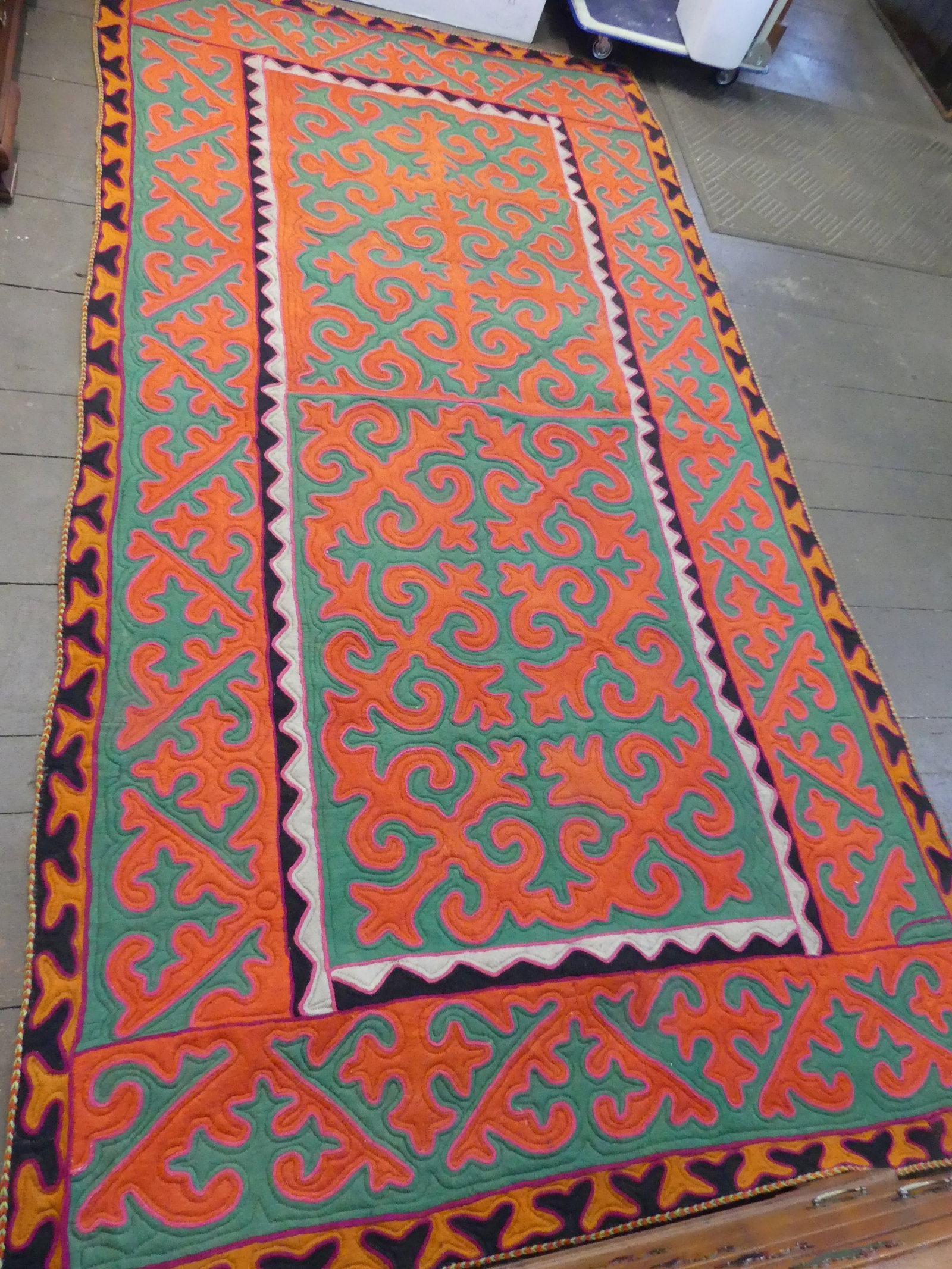 SHYRDAK 11 FOOT FELT CARPET: Vintage Shyrdak mult-layered felt rug in colorful geometric design, from the Kyrgyzstan region of Central Asia. Size: 11 ft long x 5 ft 6 inches with heavy wool backing. Excellent condition. These rug