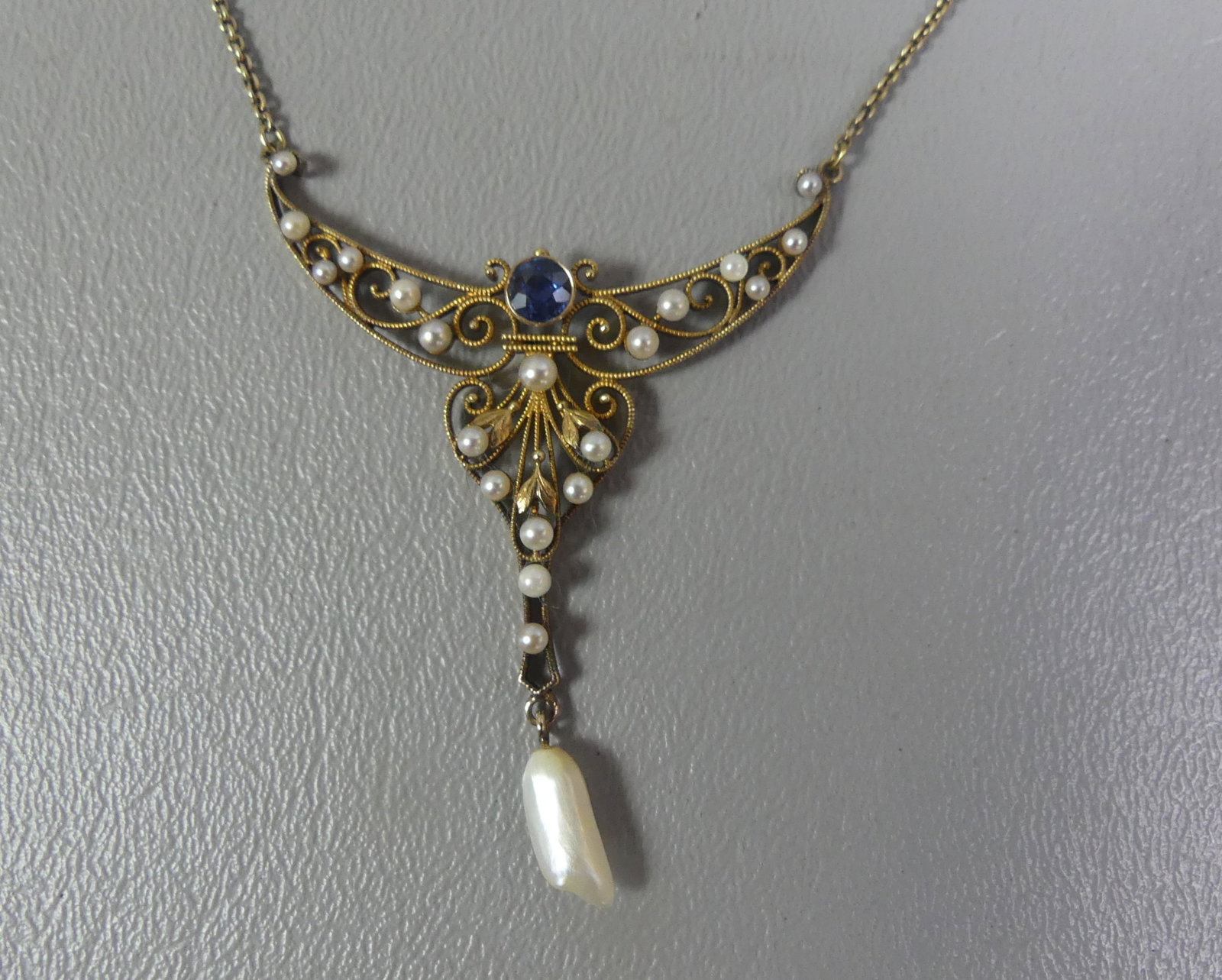 14K GOLD VICTORIAN NECKLACE: Victorian 14k gold necklace with 1.5 in wide openwork pendant set with pearls and sapphire. 14 in long. Weighs 4.8 dwt. Note: We can ship this in-house.