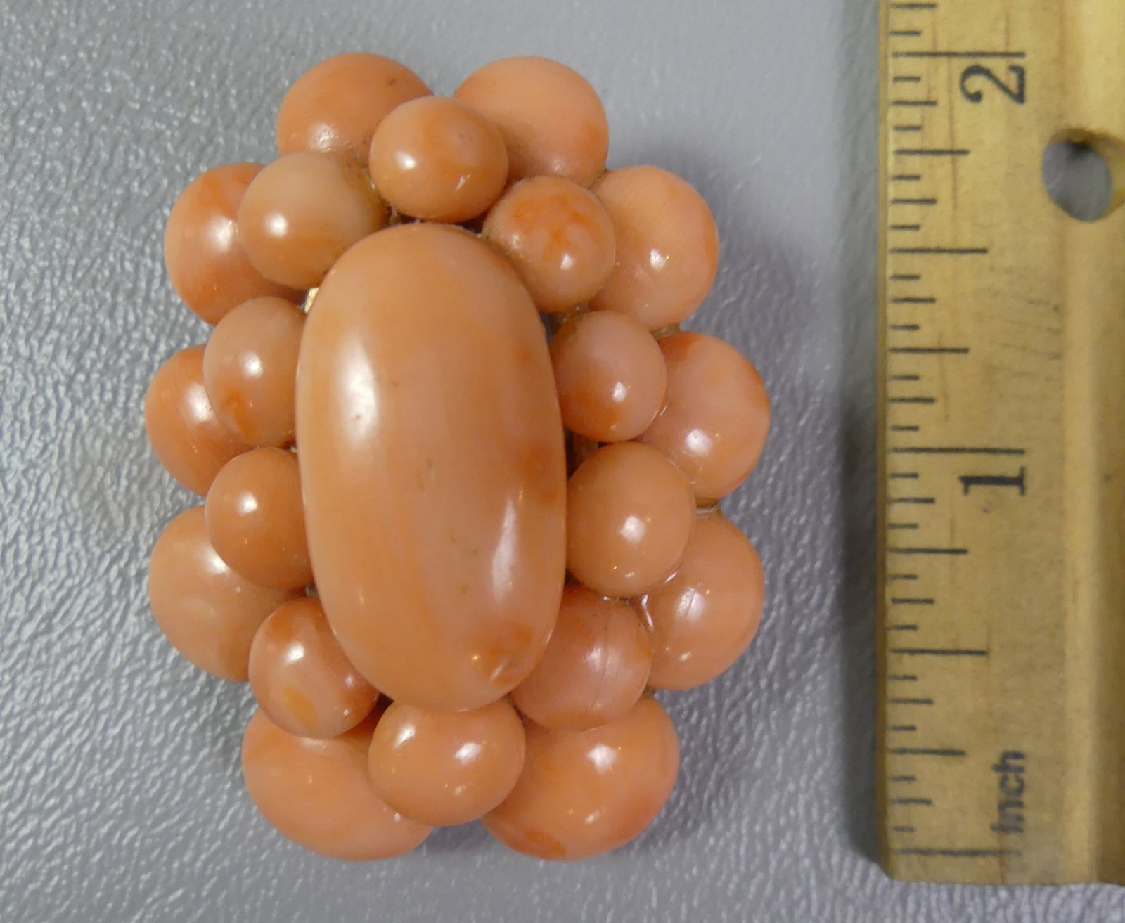 OLD CORAL & GOLD PENDANT BROOCH: Old 2 in 14k gold pendant brooch with polished coral stones (21 total). 2 in high, weighs 18.15 dwt. Note: We can ship this in-house.