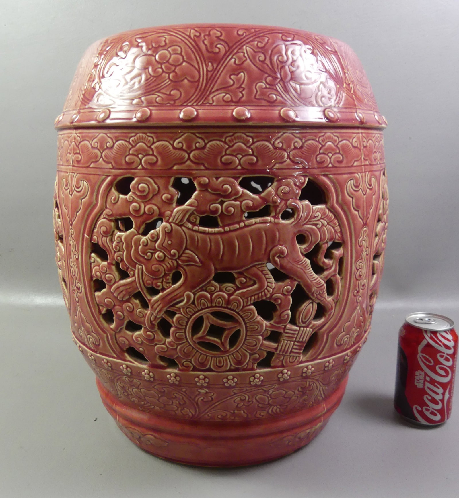 PINK MAJOLICA GARDEN SEAT: Old majolica openwork garden barrel in deep pink glaze with floral designs alternating with Chinese style tigers. 17 in tall by 11 diameter of top. VG conditon. Note: We can ship this in-house.