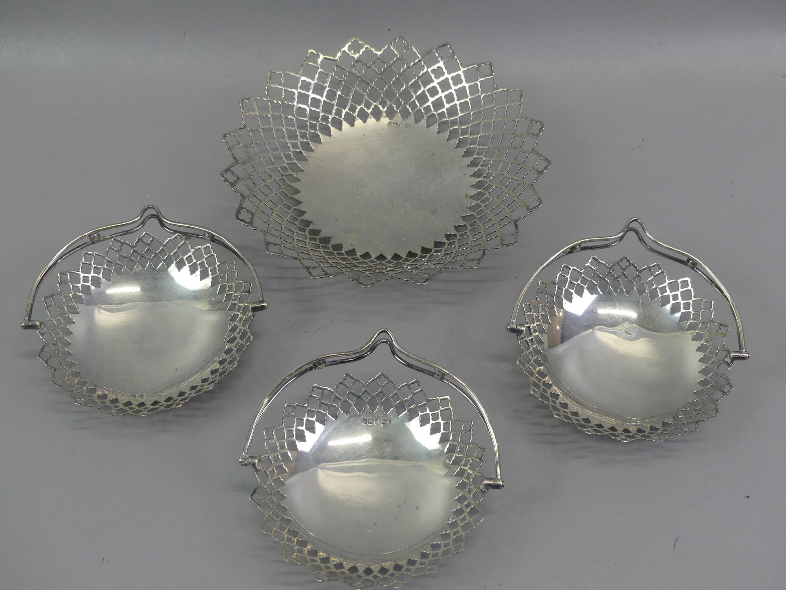 4 PC. ENGLISH STERLING SERVING BASKETS