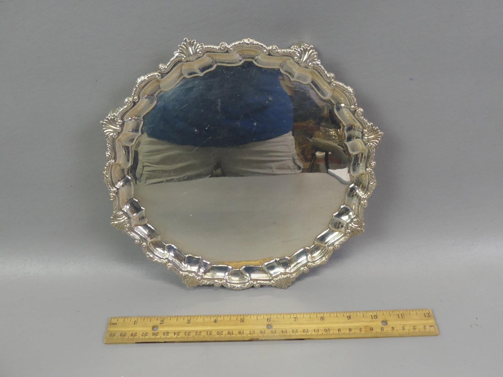ENGLISH STERLING SILVER SALVER: English sterling silver salver, hallmarks for London, 1937/38, maker LB Co Ltd. Size: 9.5 in diameter. Weighs 19 ozt.