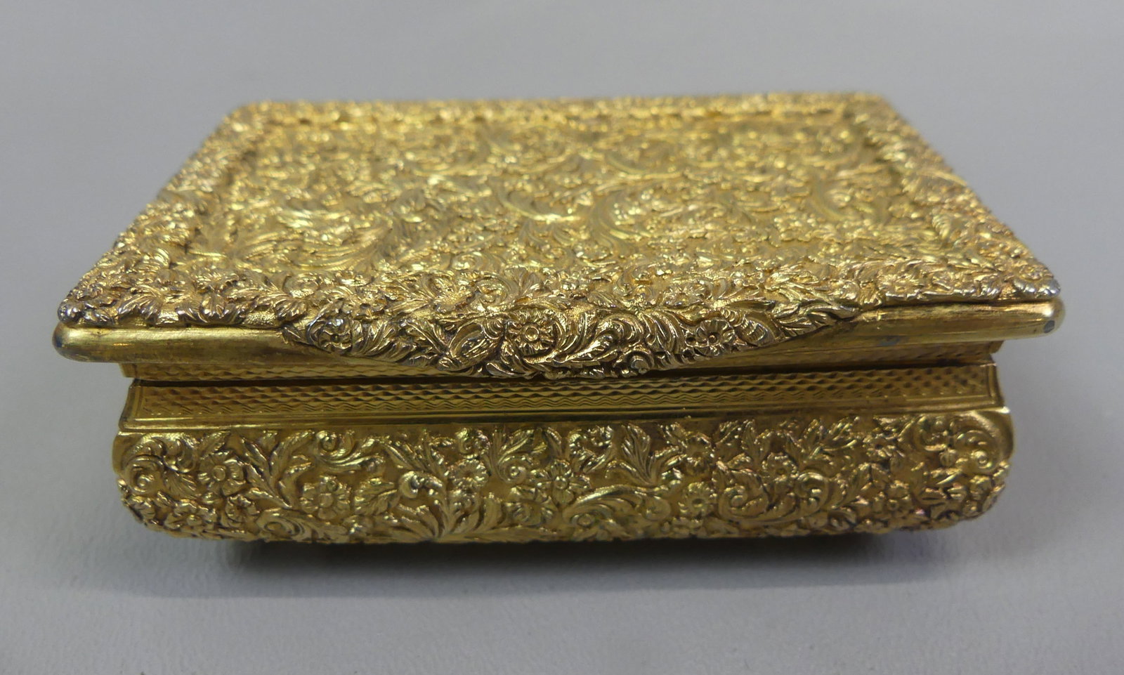 J. WILLMORE ENGLISH STERLING BOX: Heavy, exquisite antique George IV sterling silver trinket box (or stamp box?) with allover arabesque designs and gilding. Interior has presentation. Hallmarks for Joseph Willmore, Birmingham, 1826.