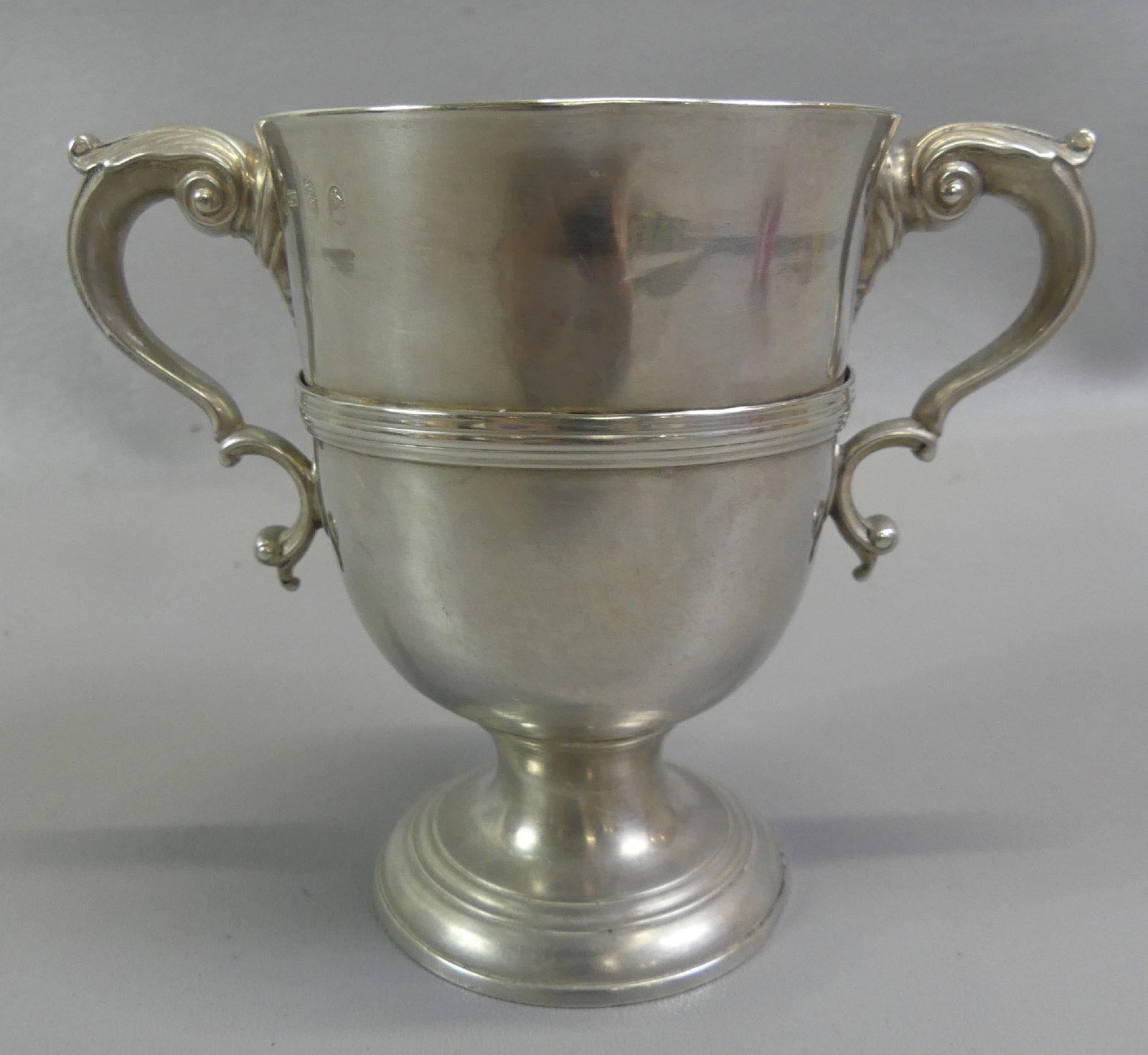 18TH C. MATTHEW WEST IRISH STERLING CUP: 18th century George III Irish sterling silver 2-handled trophy-form cup with hallmarks of Matthew West, Dublin, circa late 1700's. Size: 5.5 in high, 7 in wide, weighs 14.2 ozt. Possibly had a