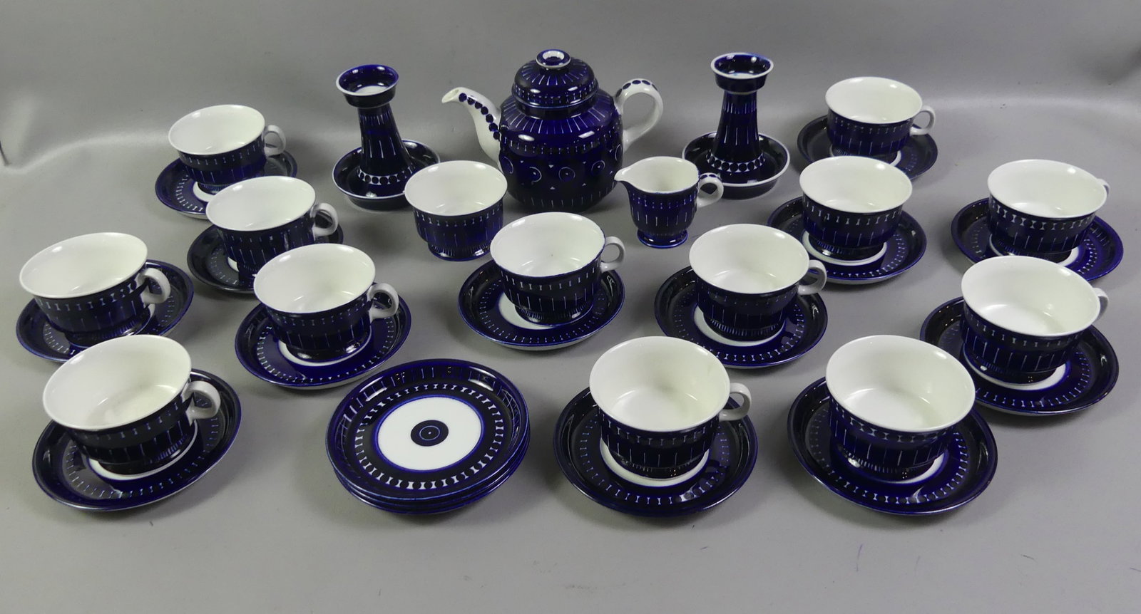 ARABIA OF FINLAND VALENCIA TEA SET: 34 pieces of Arabia of Finland china in the Valencia pattern: 13 cups and matching saucers (plus 3 extra saucers) - cups are 2.5 in high x 3.75 wide and saucer is 5.75 in diam; 6 in teapot (over $300