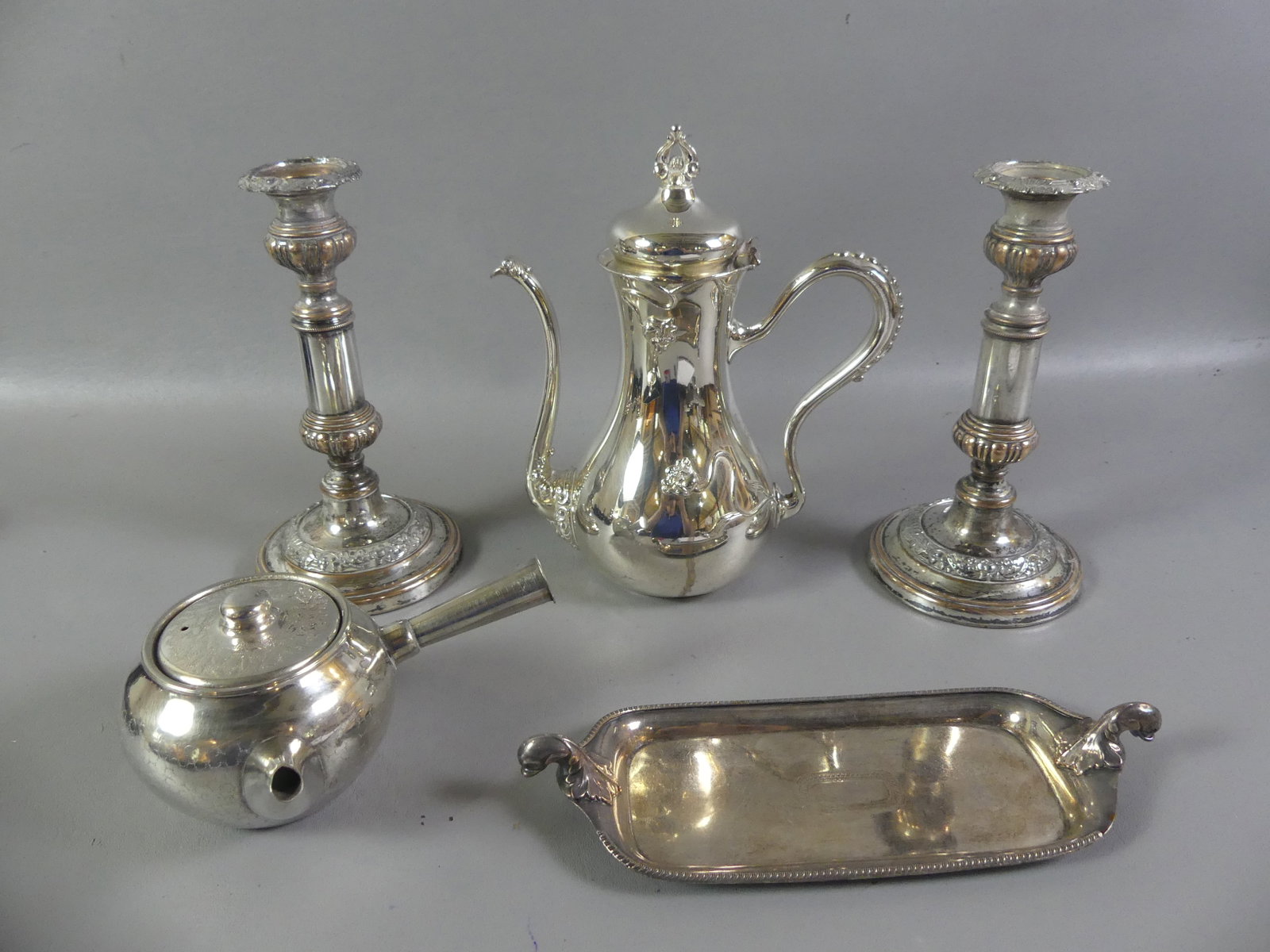 5 PCS OLD SILVER PLATE: Lot 5 pieces old silver plate: Pair of 19th century Sheffield telescoping candlesticks, from 8.5 to 10.5 in (wear); 9.5 in Art Nouveau teapot; Japanese side-handled pot; 10 in tray.