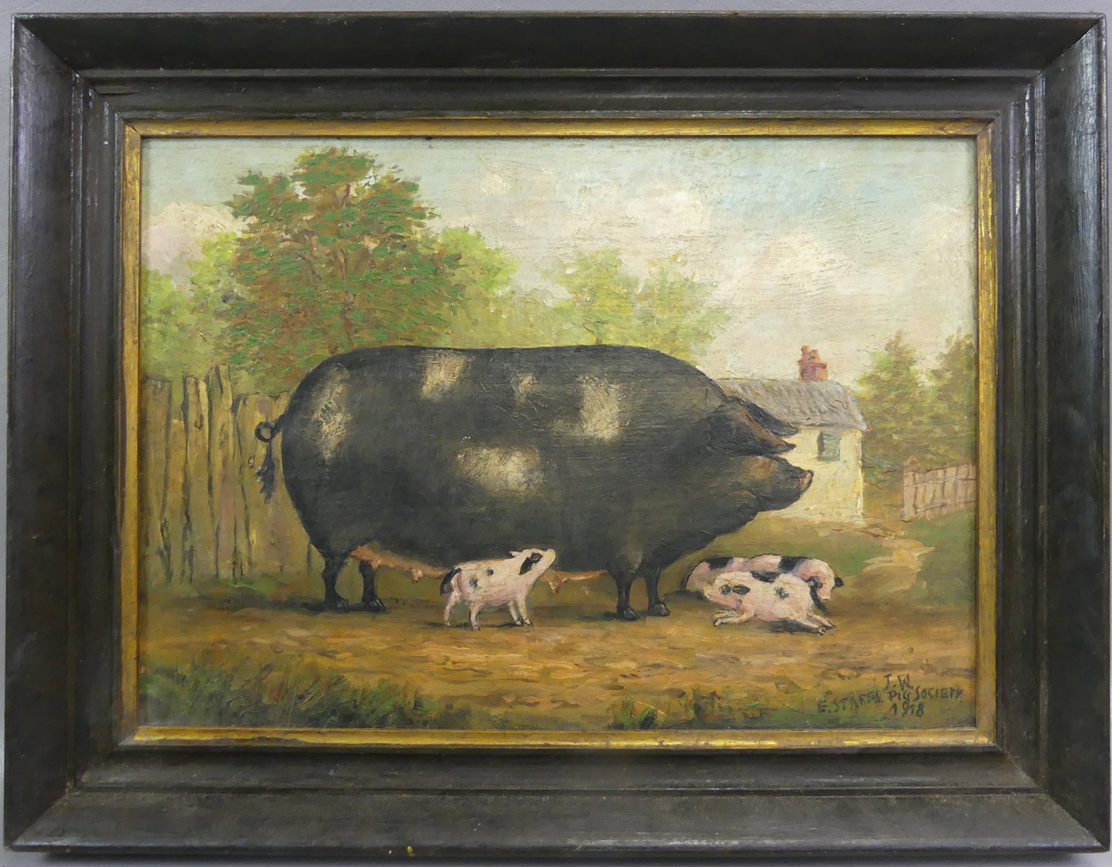 OIL PAINTING OF SOW & PIGLETS 1918: Oil painting on canvas of a barnyard scene titled on London label verso SOW AND PIGLETS signed on front: J.W. - E. Staffs Pig Society 1918. Size: 10 x 14 in, framed 13 x 17 in.