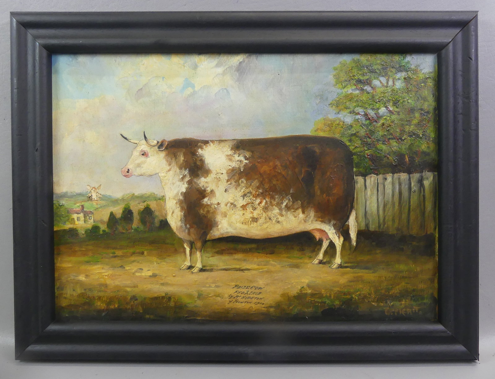 PRIZE COW PAINTING 1910: Oil painting on board of large cow in landscape identified --This prize cow was fed and bred by Mr Henry Hopeton, Layton 1910. Indistinctly signed in lower right. 13.5 x 19 in, framed 17 x 22.5 in.
