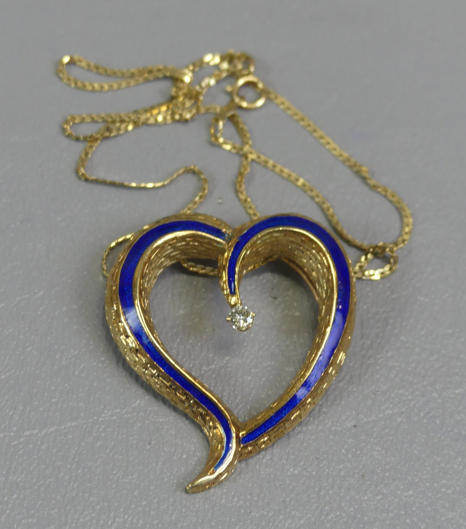 14K NECKLACE - HEART PENDANT W/DIAMONDS: 14k gold 15 in necklace having a hear shaped 14k pendant with blue enamel trim and diamond center (1.5 in long). Weighs 9.5 dwt.