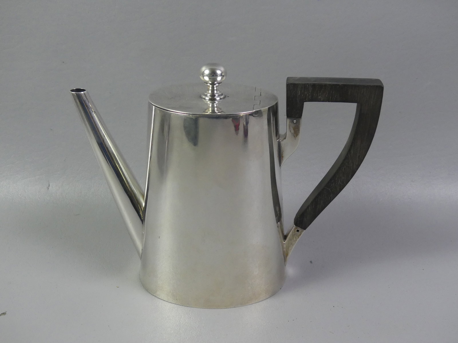 MAUSER STERLING SILVER TEAPOT: Sterling silver 2 pint ovoid teapot with wood handle, hallmarks of Mauser #1771.6.25 in tall, weighs 17.58 ozt. No dents or monograms