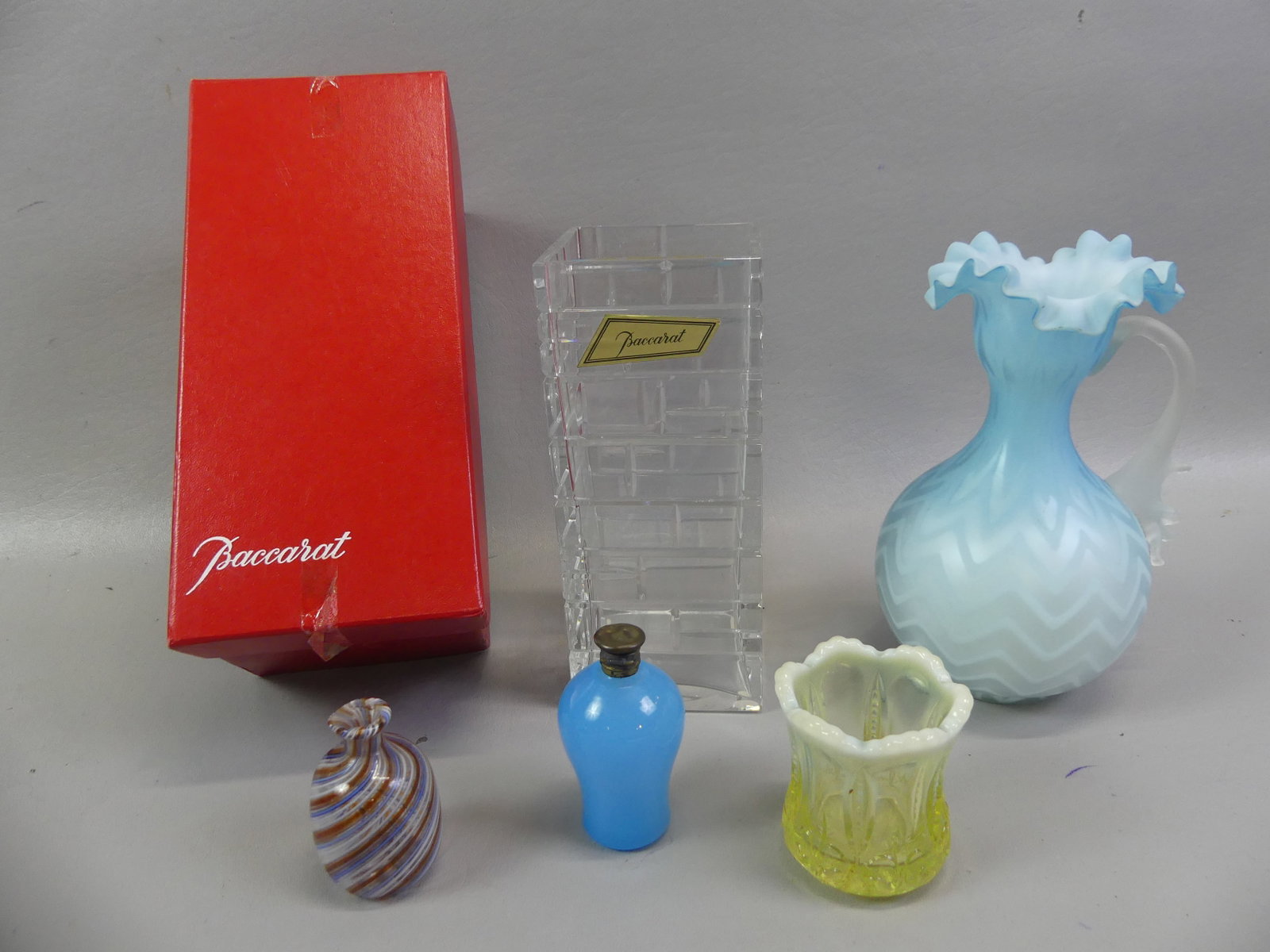 5 ASSORTED GLASS ITEMS INCL. BACCARAT: Lot of 5 estate glass items: 7.25 in Baccarat square crystal vase in original box; satin glass ewer; blue opal perfume; mini glass Venetian bottle; tooth pick holder.