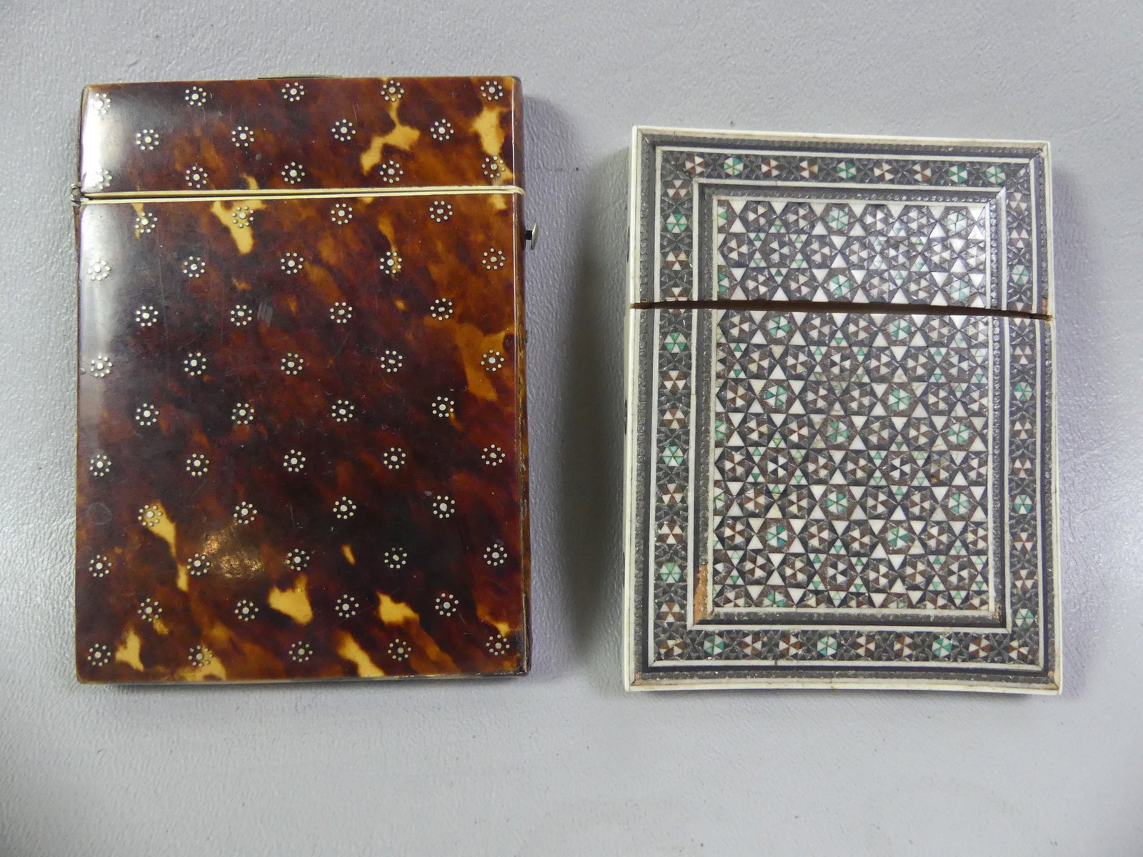 2 INLAID CARD CASES: Lot 2 old card cases: Victorian shell veneer with silver mounts and delicate inlay, probably English 4 x 3 inches; and an Anglo-Indian micro-mosaic inlaid card case, 3.25 x 2.75 inches.