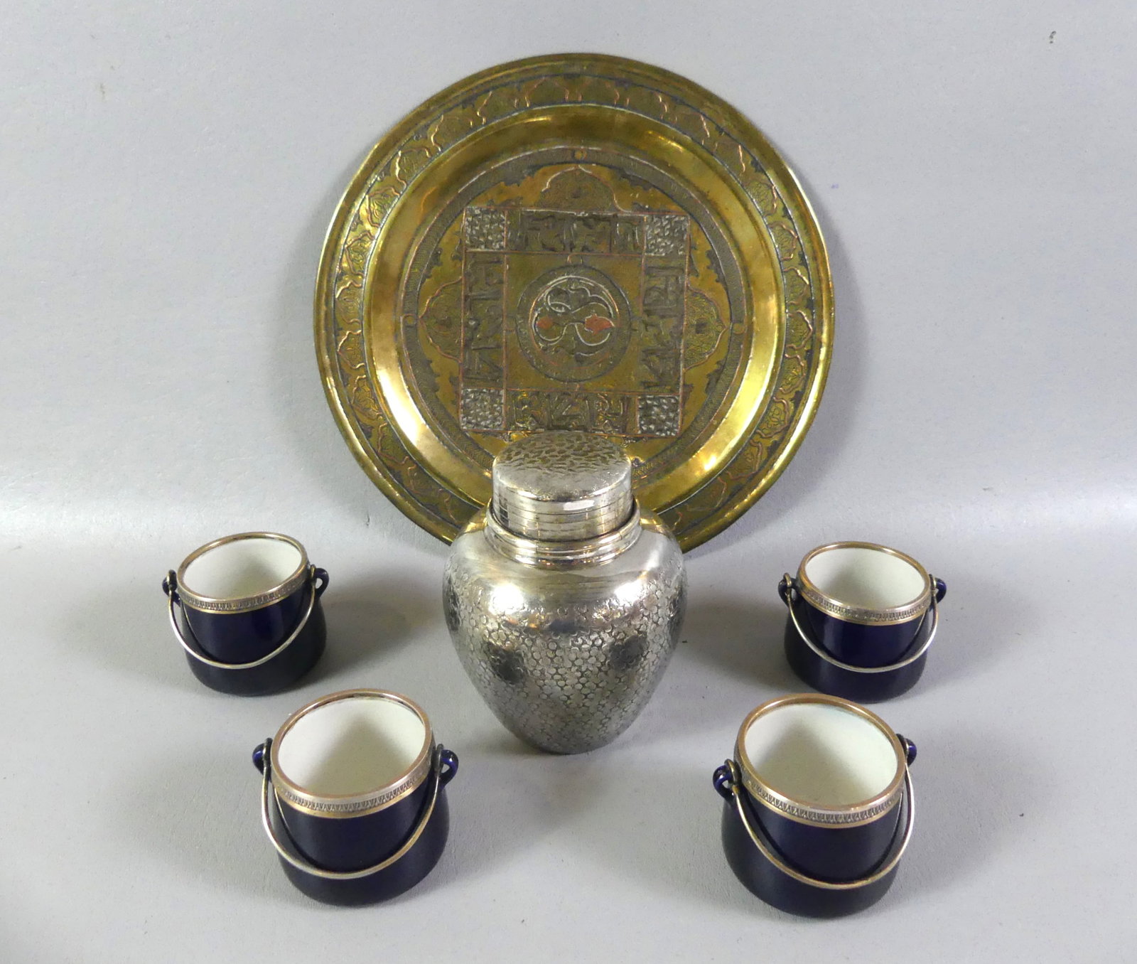 6 ESTATE ITEMS - ARAM TEA CADDY ETC: Lot of assorted estate items: Silver plated tea caddy signed Michael Aram, 5 in; set 4 cobalt blue porcelain pots de cr?me with silver hallmarked handles and trim, 2 in; and silver inlaid 10 in Arabic