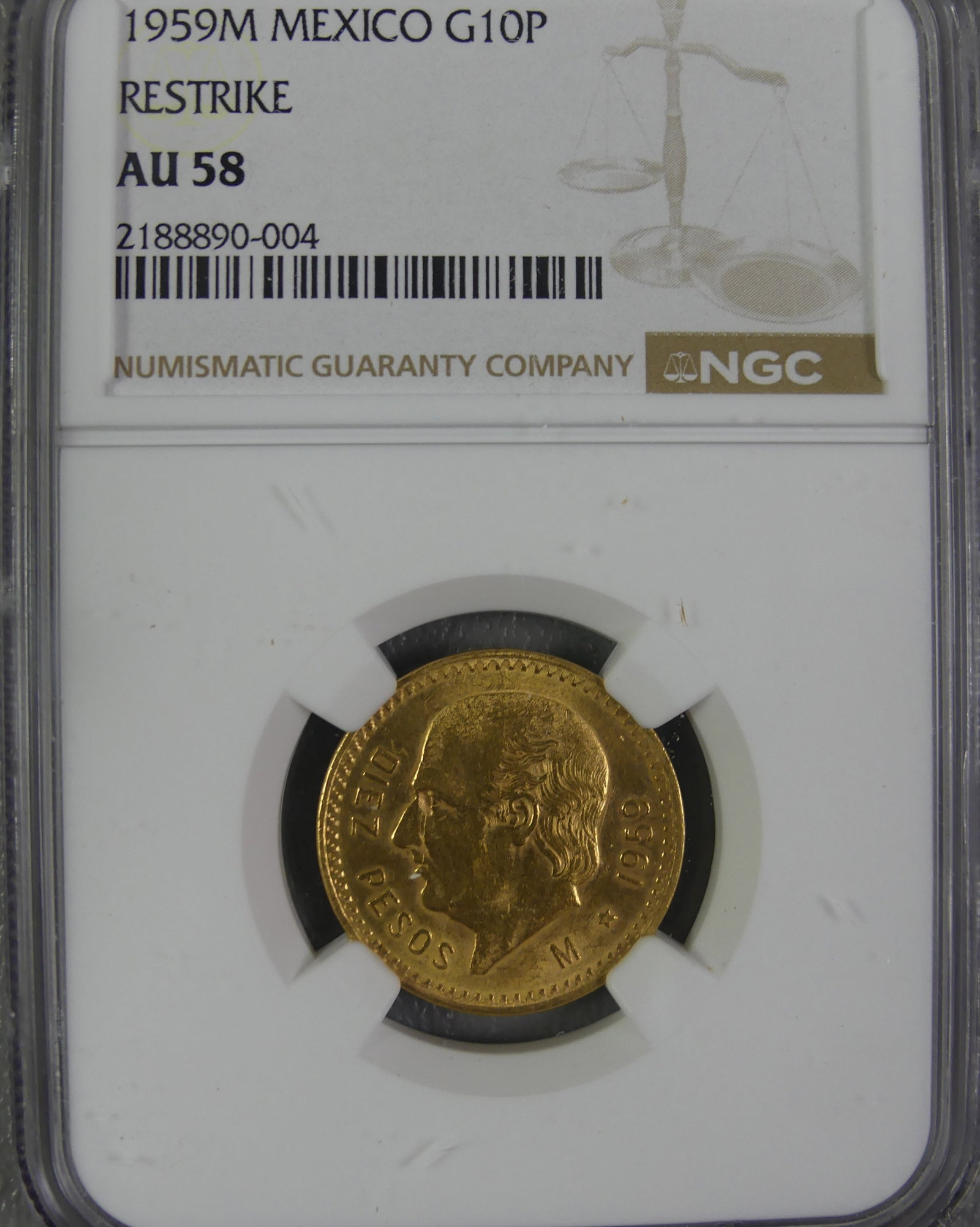 1959 MEXICAN 10 PESO GOLD COIN: NGC slabbed and graded 1959M Mexican 10 pesos gold coin (restrike). Graded AU-58. 19.05mm. 8.33 grams and .90 gold content