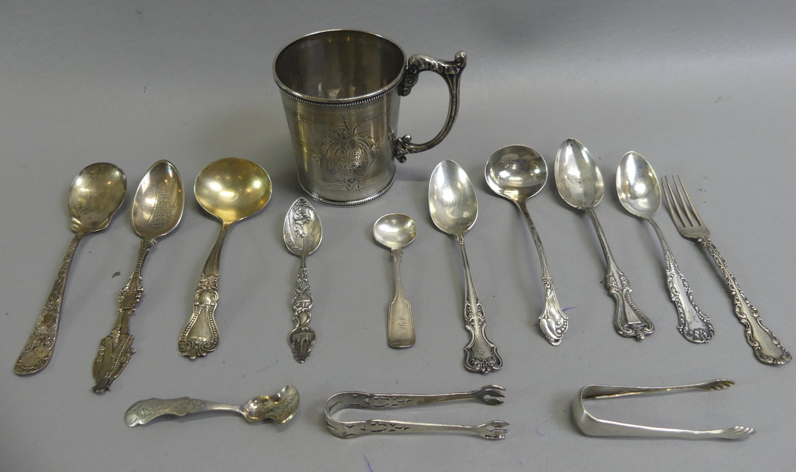 13 PCS. SILVER FLATWARE & COIN SILVER CUP: Lot of silver: 13 pieces of flatware (most 925 with a couple coin or .800 pcs) plus an engraved coin silver mug, 3.25 in tall. Cup is 3.08 ozt and flatware 7.25 ozt for total 10.33 ozt.