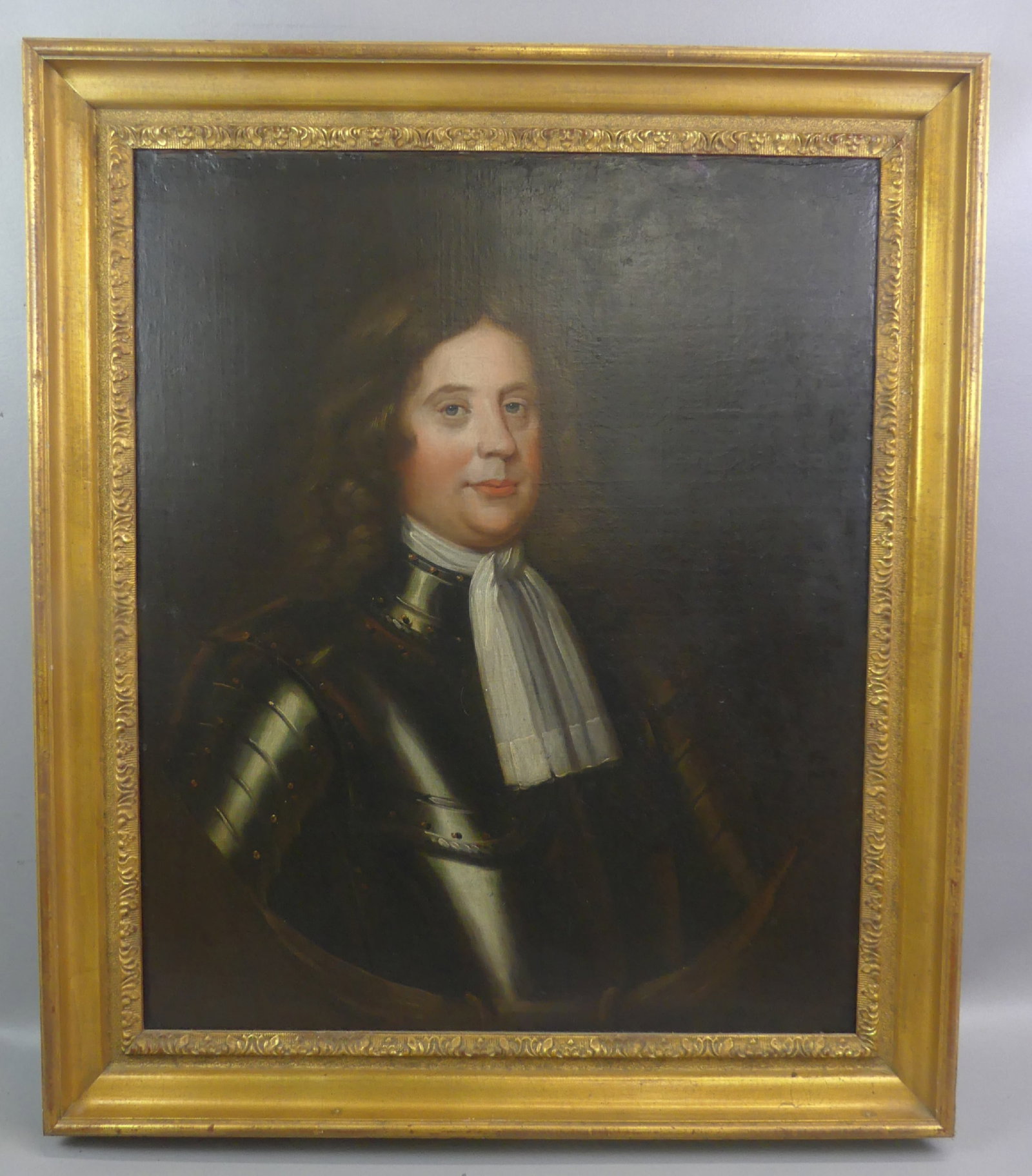 ANTIQUE PORTRAIT OF KNIGHT IN ARMOR: 18th century oil painting on canvas, portrait of a knight in armor. Has London label on stretcher. Unsigned, 29 x 24 in, framed 36 x 31. Good condition.