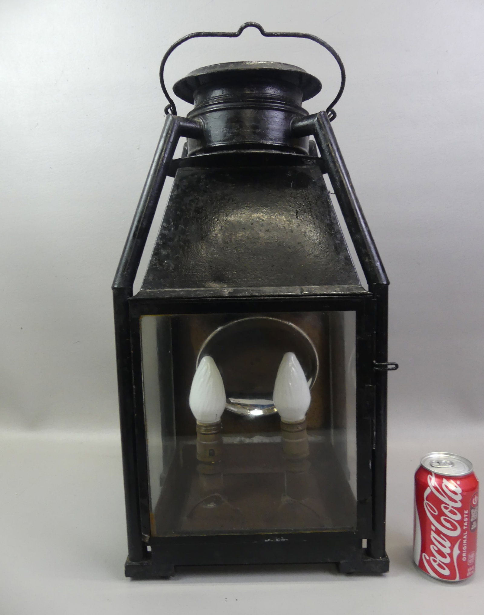 LARGE ANTIQUE METAL LANTERN: Antique tin and metal lantern with reflector (electrified). 22 x 9 x 11 in. Front door corner has some separation, reflector loos, some rust inside.