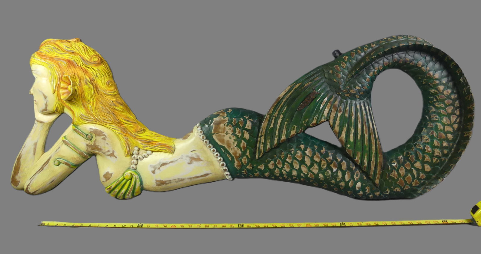 LARGE CARVED WOOD MERMAID PLAQUE: Large carved and polychromed wood wall sculpture of a mermaid. 58 in long x 21 high, 4 in thick.