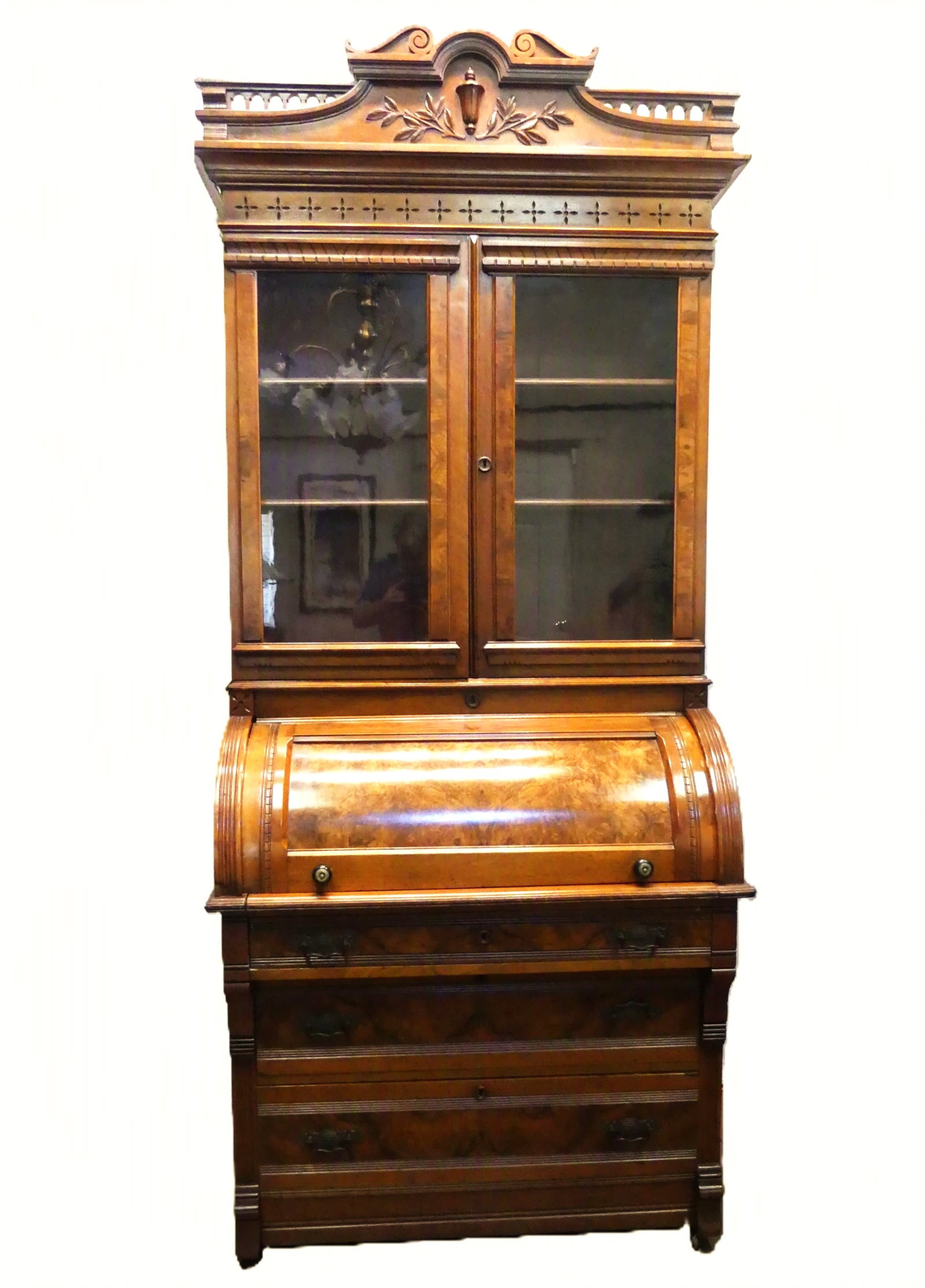 VICTORIAN ROLL TOP SECRETARY DESK: Victorian walnut C roll top secretary desk with fitted interior, slide-out writing suface, 3 lower drawers and upper doored compartment with 2 wood shelves. Upper crest is removable. Height with