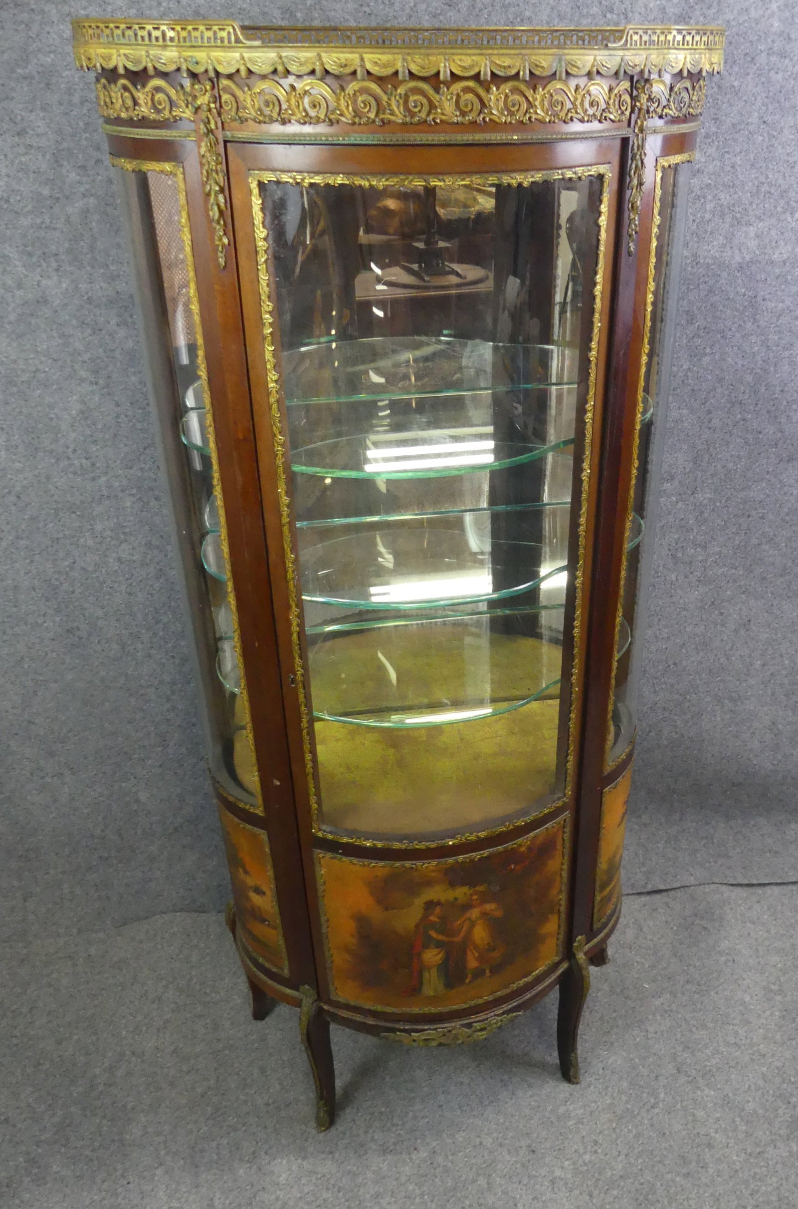 VERNI MARTIN ANTIQUE FRENCH VITRINE: Antique Verni Martin French curved glass vitrine (front is plexiglass) with 3 shaped glass shelves. It has a red marble top, ormolu mounts, and lower painted panels of a couple in landscape. 62 in
