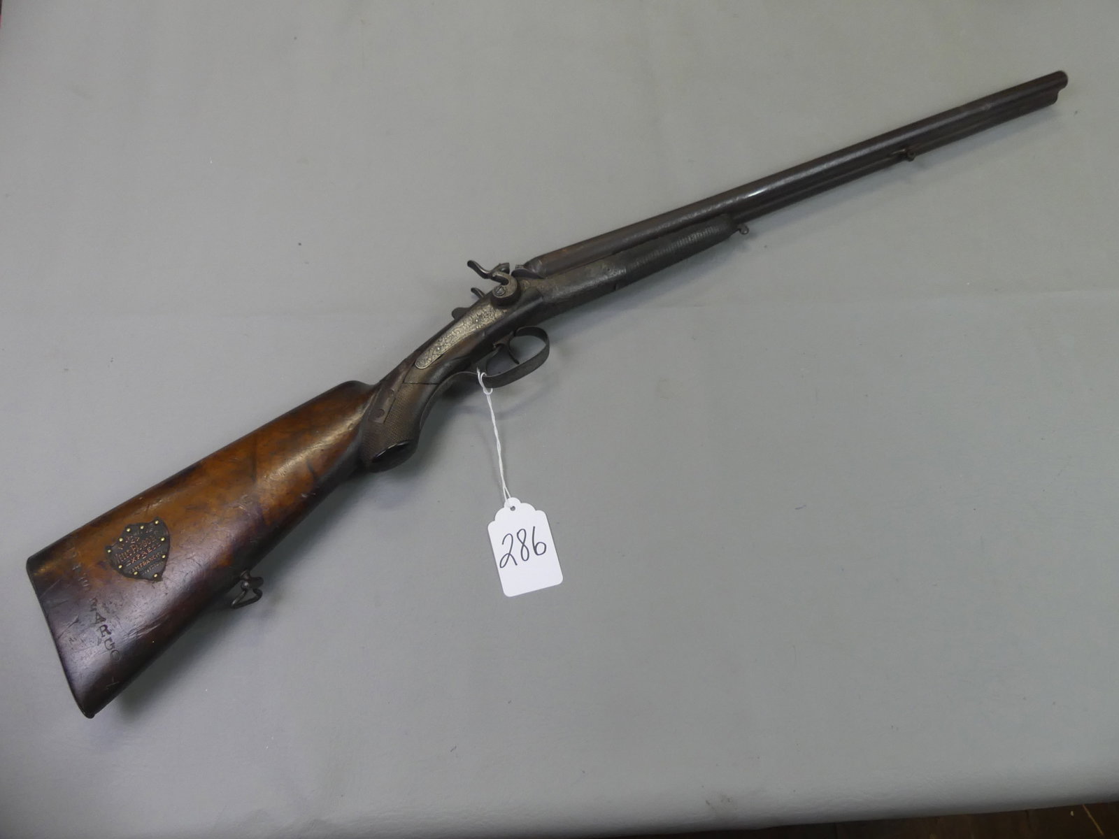 WELLS FARGO SAN FRANCISCO COACH SHOTGUN: Antique double barreled percussion-fire shotgun signed G.F. Stormer, Herzberg A.H. It has the Wells Fargo stamped name on walnut butt with shield stamped --Property of Wells Fargo Express & Co San Fra