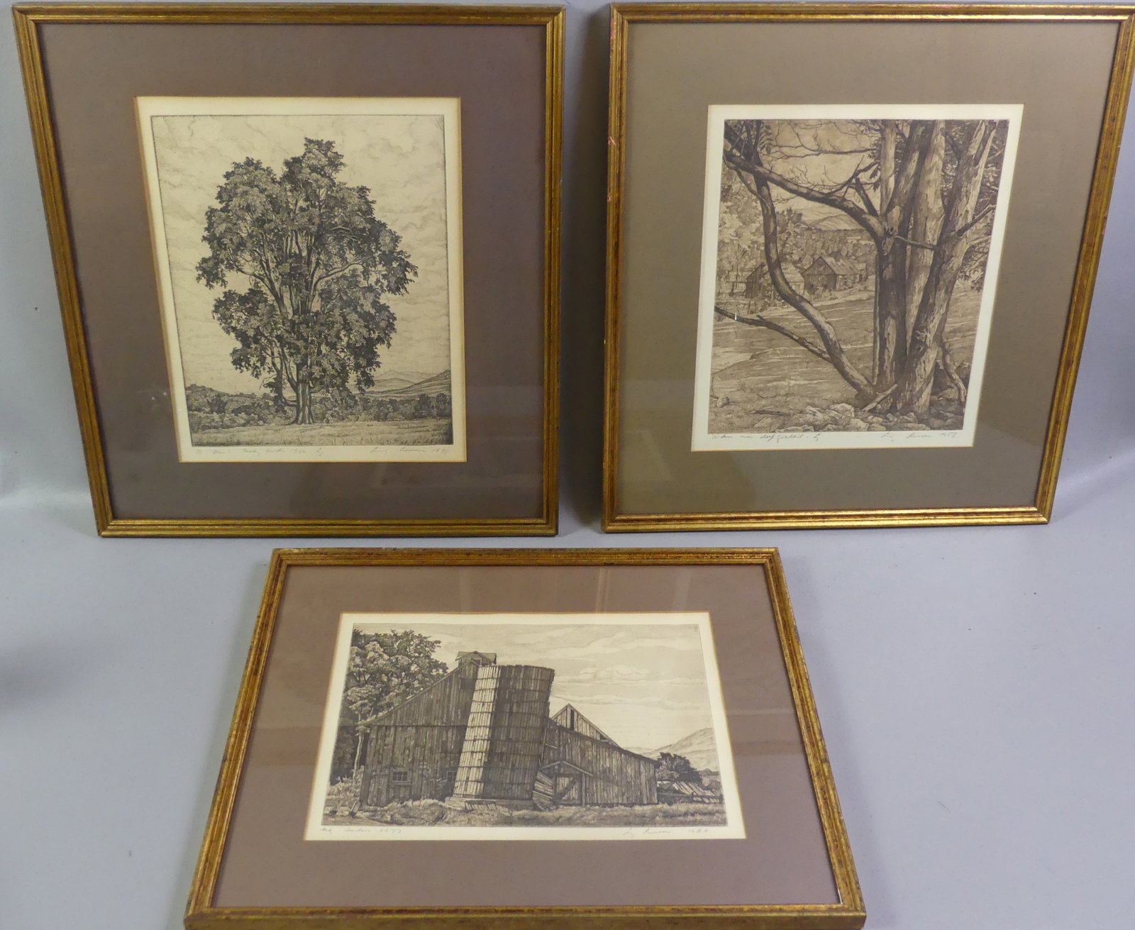 3 LUIGI LUCIONI ETCHINGS: Lot of 3 Luigi Lucioni framed etchings: Lone tree dated 1948, 13 x 10.5, framed 19 x 17.5 in; Large old barn dated 1962, 9.5 x 13 in, framed 15 x 19 in; and large tree and farm dated 1953, 13 x 10.5 i