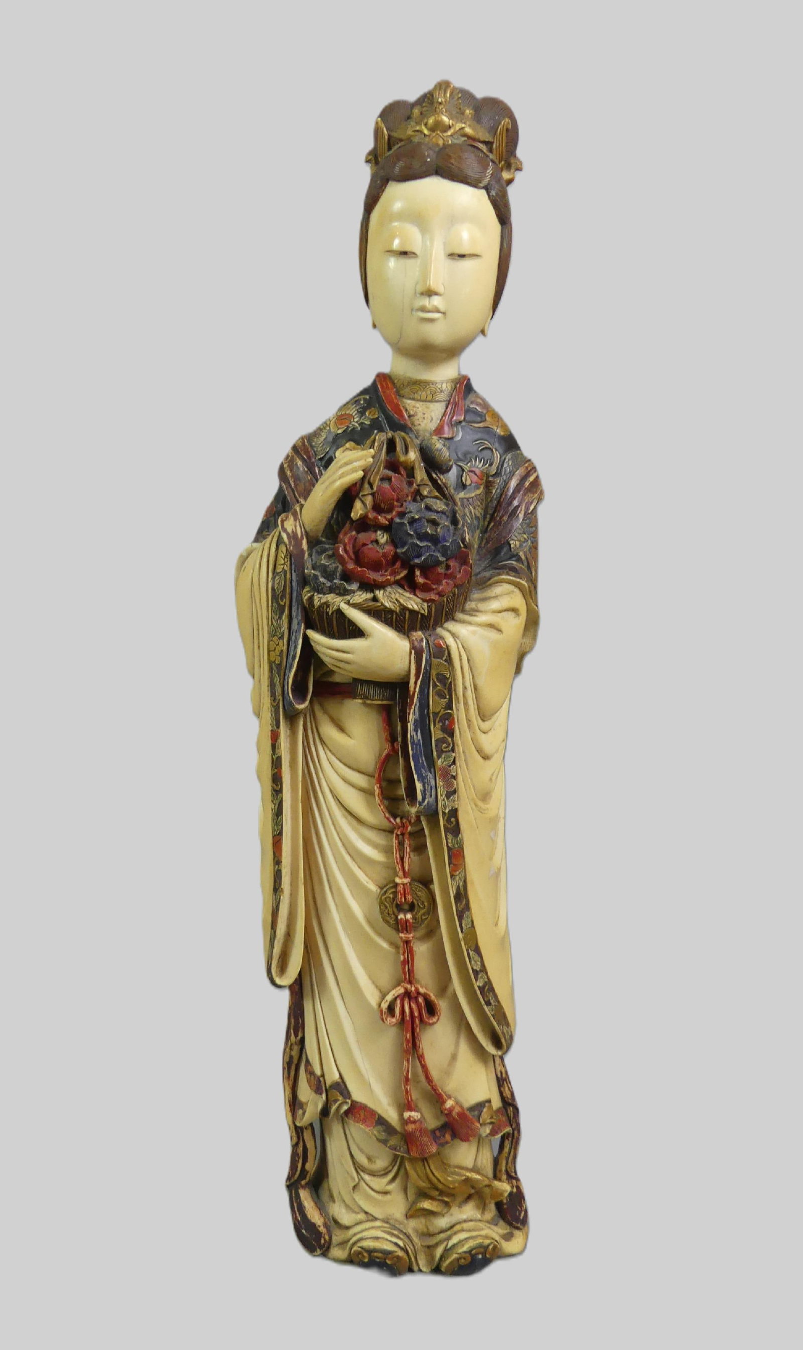 SUPERB CARVED CHINESE FIGURE OF NOBLE WOMAN: Exquisite 19th century organic carved Chinese figure of a noble woman holding basket of flowers with polychromed decoration. 20 in tall x 4.5 in wide, weighs over 10 lbs. VG condition.