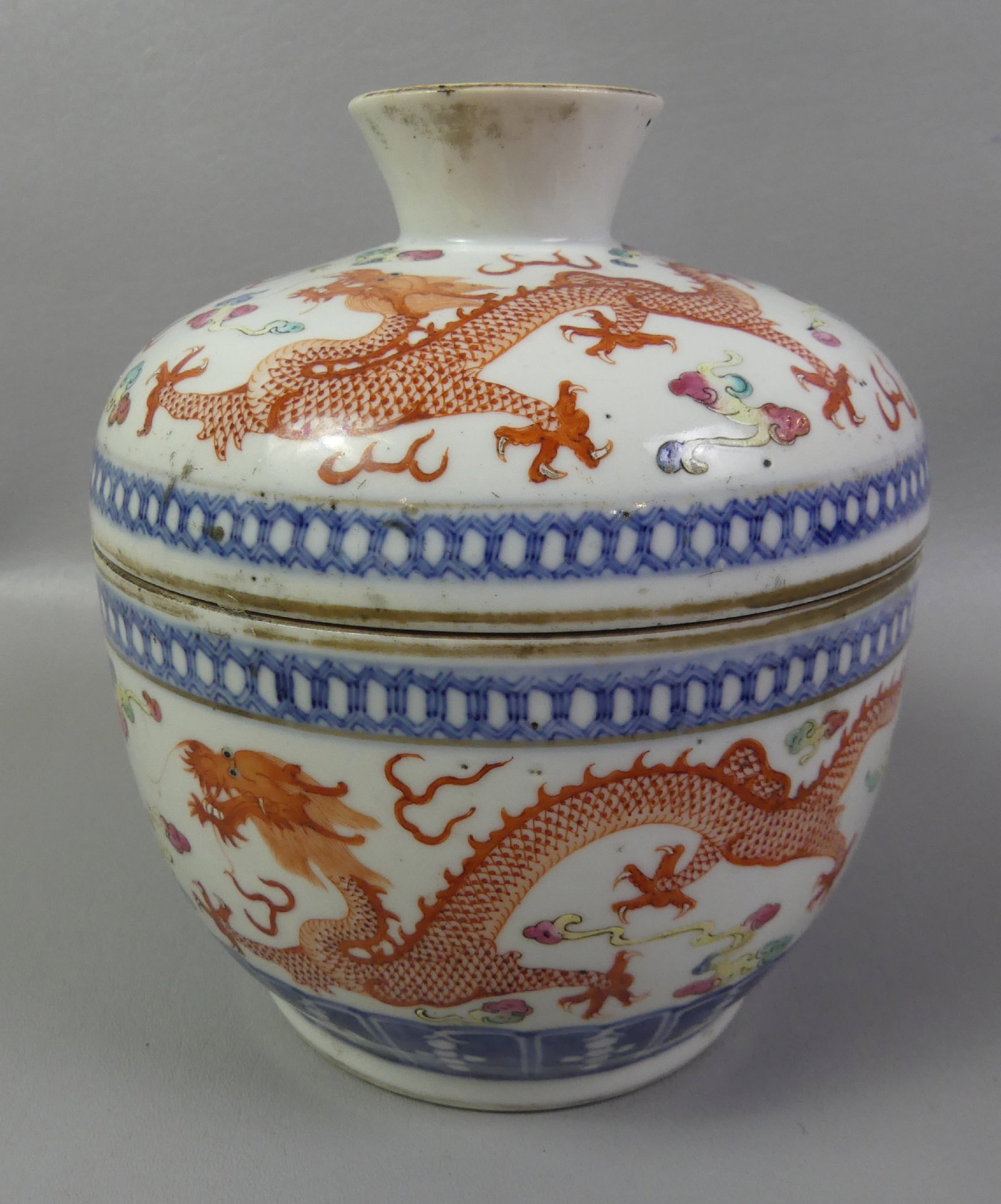 ANTIQUE CHINESE COVERED BOWL - GUANGXU: 19th century Chinese Famille Rose covered bowl with painted iron-red decoratoin of dragons. Signed with Guangxu mark circa 1880. 7 in tall x 6.5 in diameter. Good condition with few small rim chips.